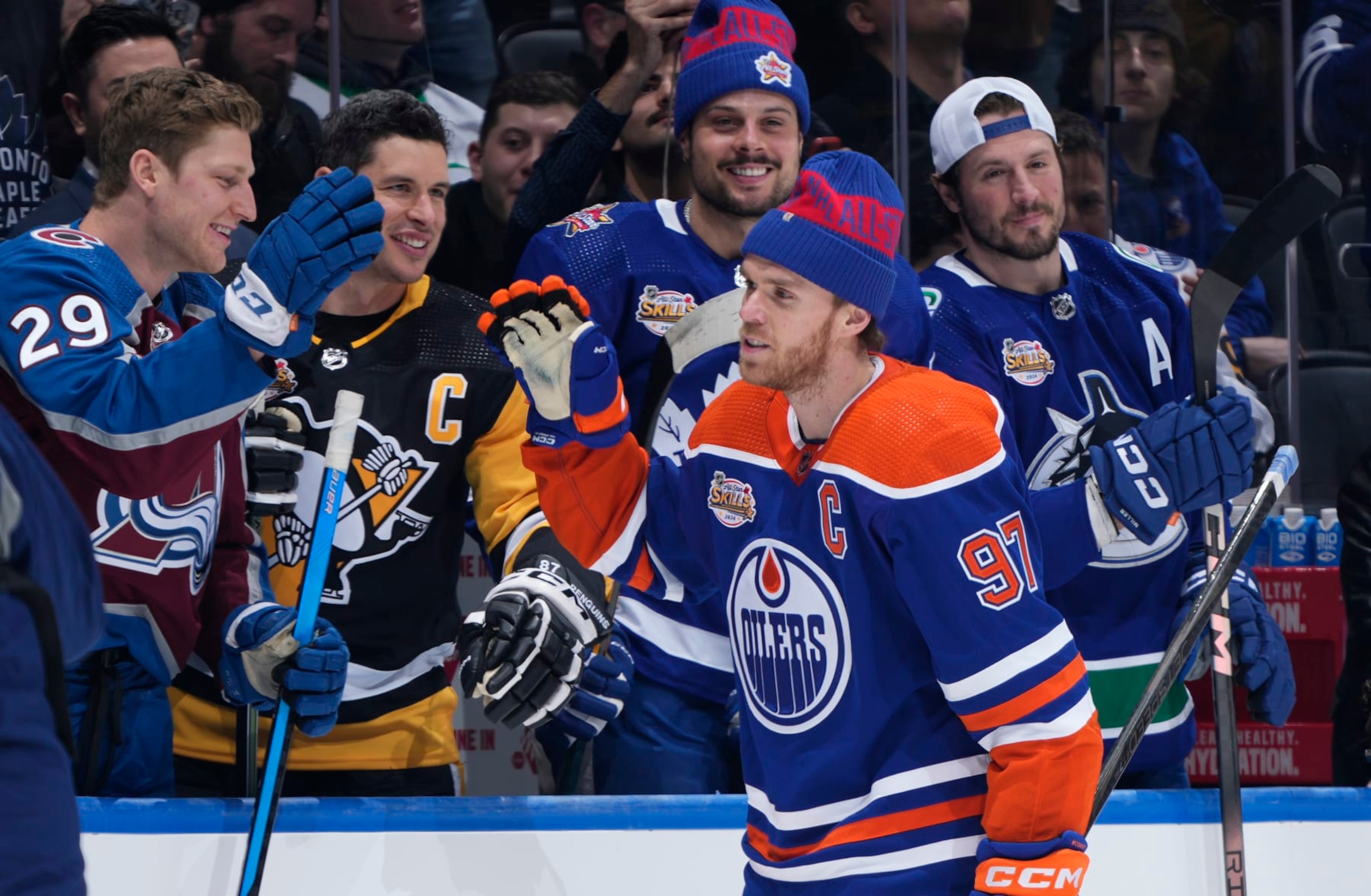 TORONTO, ONTARIO - FEBRUARY 02: Connor McDavid #97 of the Edmonton Oilers gets high fives from the bench after competing in the Pepsi NHL Obstacle Course competition during the 2024 NHL All-Star Skills Competition at Scotiabank Arena on February 02, 2024 in Toronto, Ontario, Canada. (Photo by Mark Blinch/NHLI via Getty Images)
