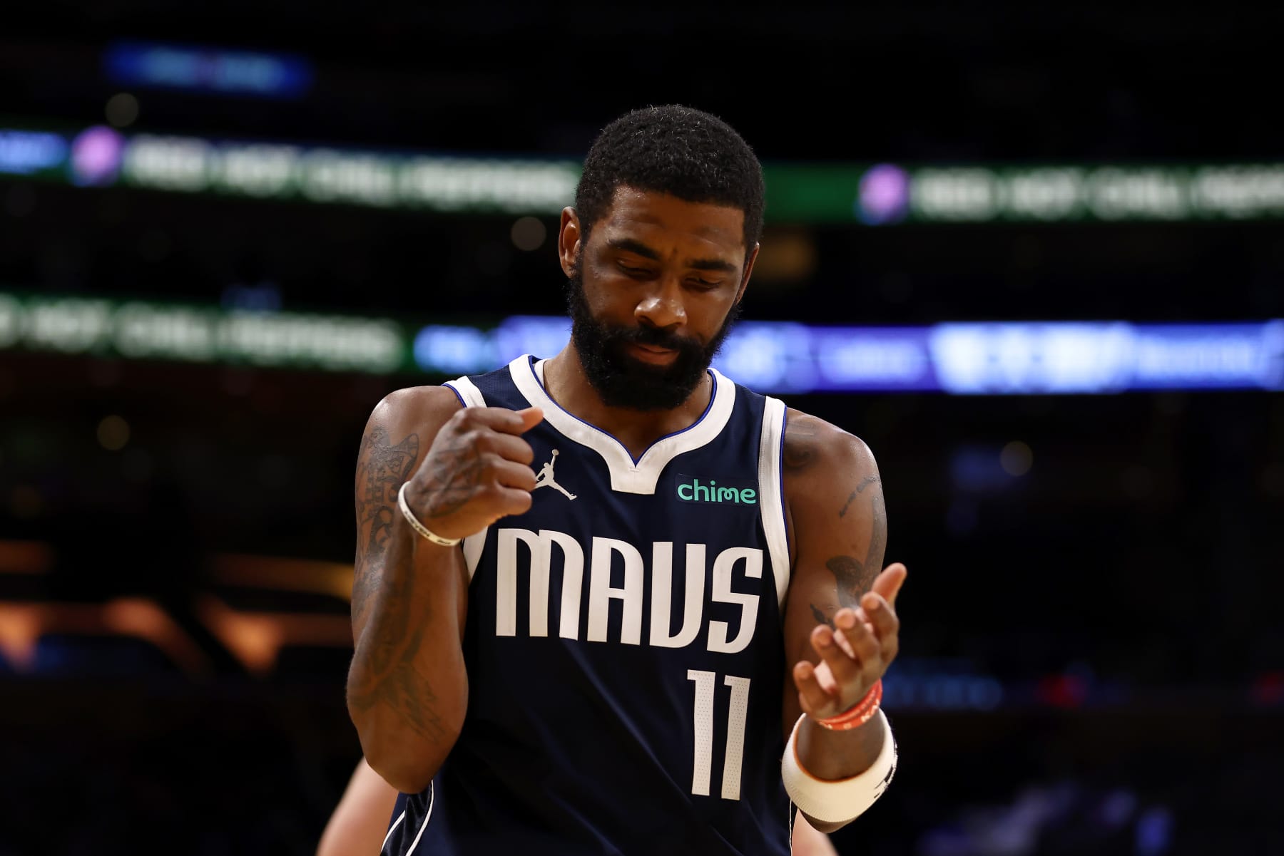 LOS ANGELES, CALIFORNIA - JANUARY 17:  Kyrie Irving #11 of the Dallas Mavericks reacts to a play during the second quarter against the Los Angeles Lakers at Crypto.com Arena on January 17, 2024 in Los Angeles, California. NOTE TO USER: User expressly acknowledges and agrees that, by downloading and or using this photograph, User is consenting to the terms and conditions of the Getty Images License Agreement. (Photo by Katelyn Mulcahy/Getty Images)