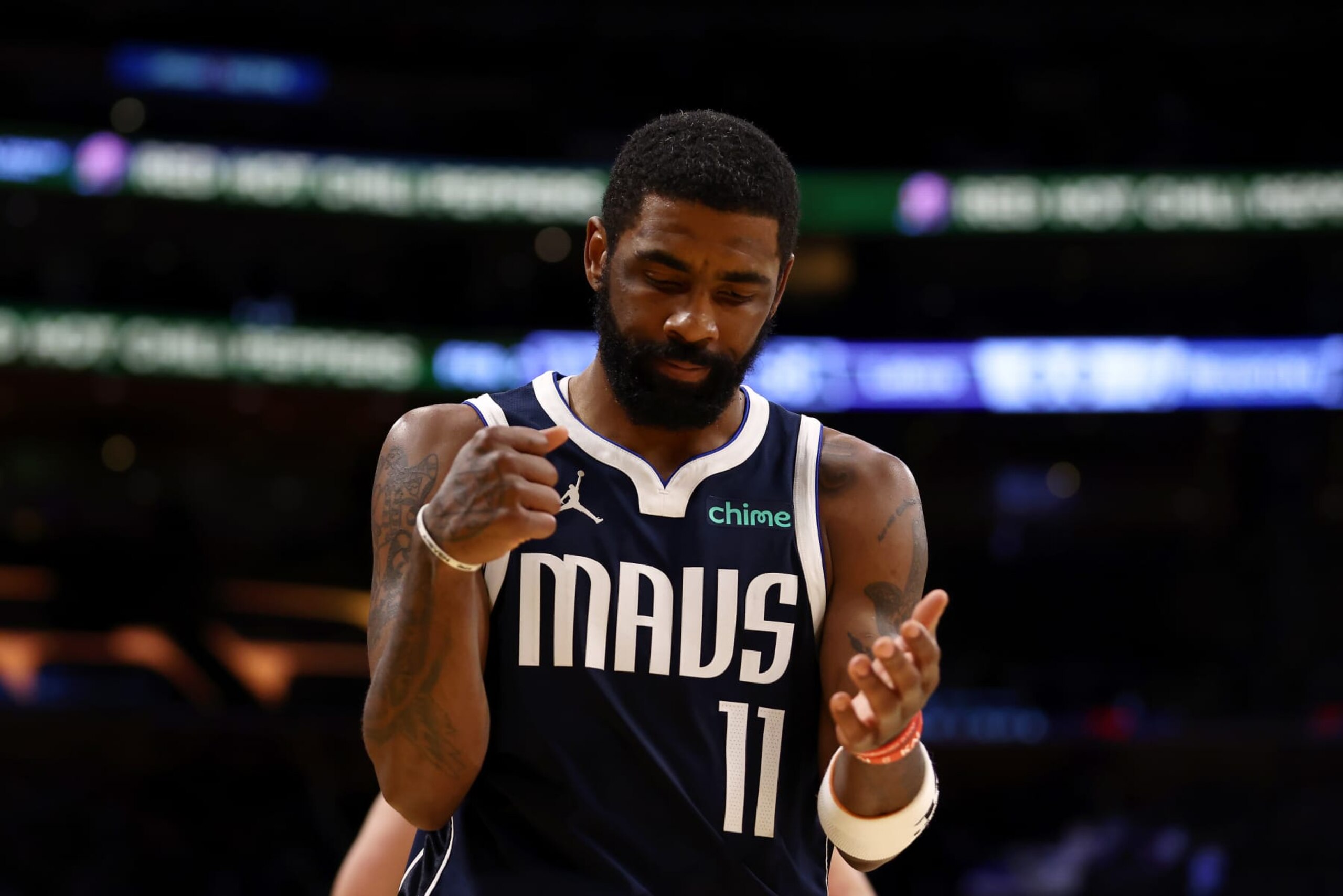 LOS ANGELES, CALIFORNIA - JANUARY 17:  Kyrie Irving #11 of the Dallas Mavericks reacts to a play during the second quarter against the Los Angeles Lakers at Crypto.com Arena on January 17, 2024 in Los Angeles, California. NOTE TO USER: User expressly acknowledges and agrees that, by downloading and or using this photograph, User is consenting to the terms and conditions of the Getty Images License Agreement. (Photo by Katelyn Mulcahy/Getty Images)