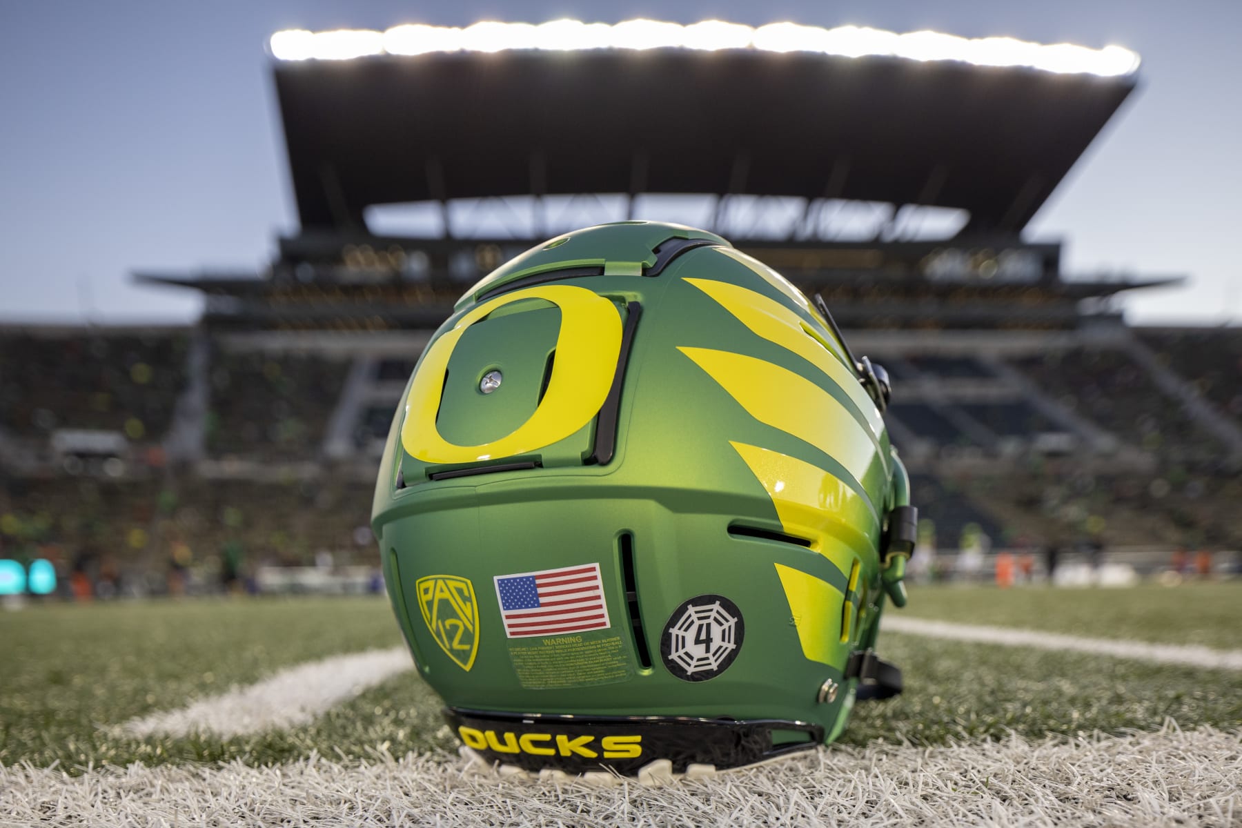 EUGENE, OREGON - NOVEMBER 24: An Oregon Ducks helmet on the field at Autzen Stadium before the football game between the Oregon Ducks and the Oregon State Beavers at Autzen Stadium  November 24, 2023 in Eugene, Oregon. (Photo by Tom Hauck/Getty Images)
