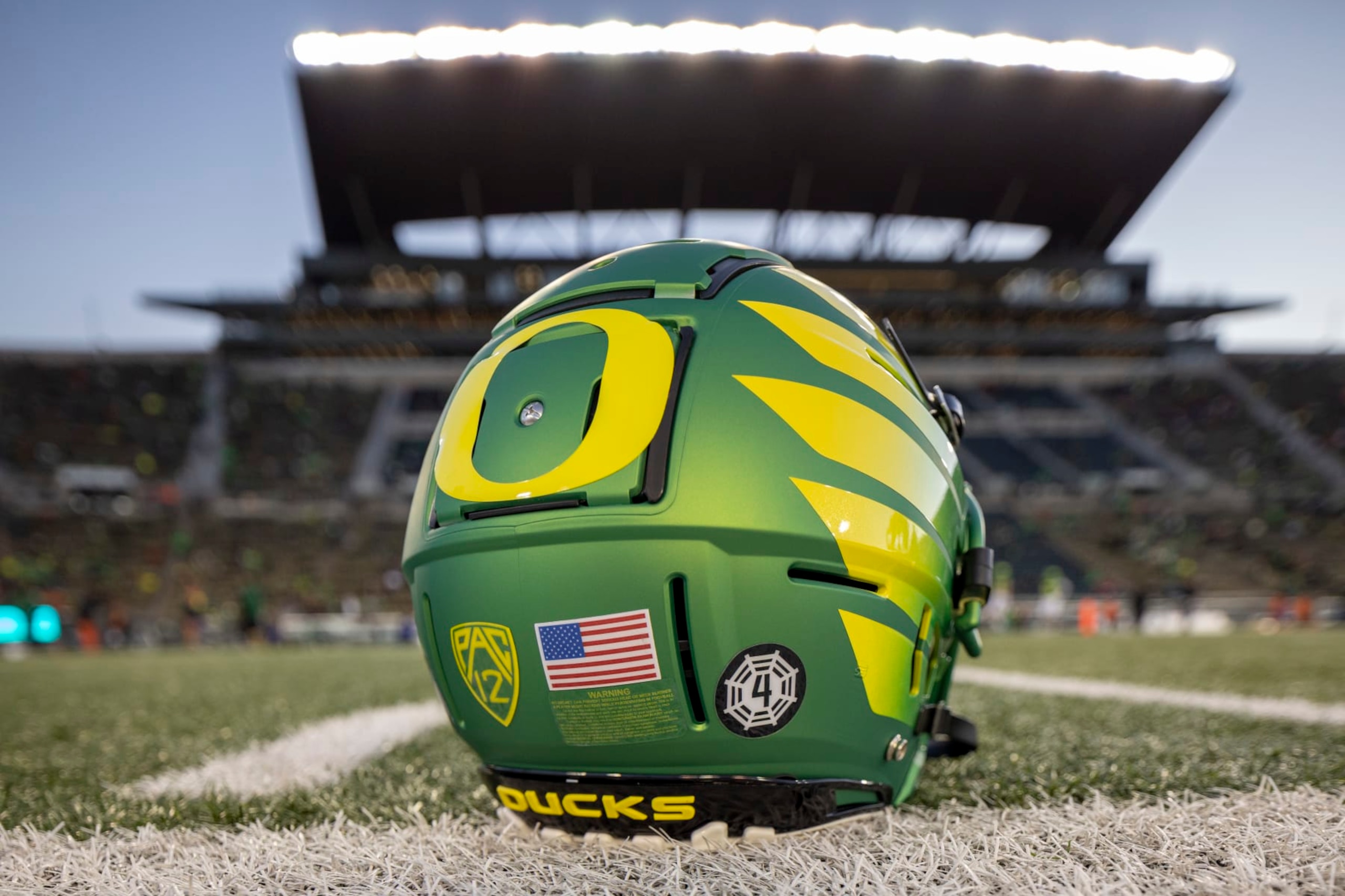 EUGENE, OREGON - NOVEMBER 24: An Oregon Ducks helmet on the field at Autzen Stadium before the football game between the Oregon Ducks and the Oregon State Beavers at Autzen Stadium  November 24, 2023 in Eugene, Oregon. (Photo by Tom Hauck/Getty Images)