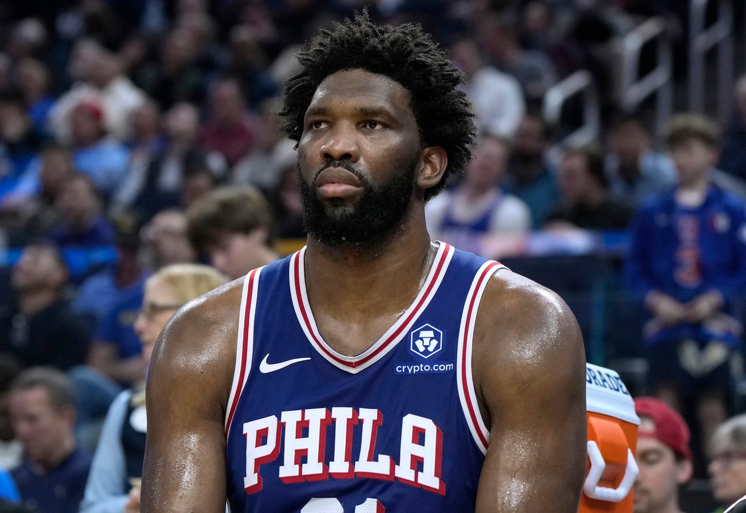 SAN FRANCISCO, CALIFORNIA - JANUARY 30: Joel Embiid #21 of the Philadelphia 76ers looks on from the bench against the Golden State Warriors during the fourth quarter of an NBA basketball game at Chase Center on January 30, 2024 in San Francisco, California. NOTE TO USER: User expressly acknowledges and agrees that, by downloading and or using this photograph, User is consenting to the terms and conditions of the Getty Images License Agreement. (Photo by Thearon W. Henderson/Getty Images)
