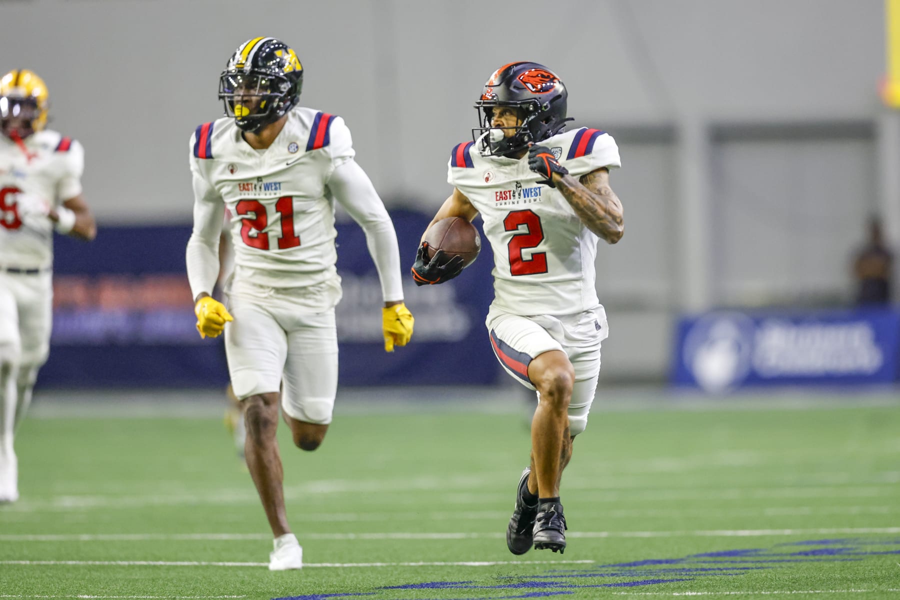 FRISCO, TX - FEBRUARY 01: East Team wide receiver Anthony Gould (2) runs for a touchdown followed by East Team safety Jaylon Carlies (21) during the East-West Shrine Bowl on February 1, 2024 at the Ford Center at The Star in Frisco, Texas. (Photo by Matthew Pearce/Icon Sportswire via Getty Images)