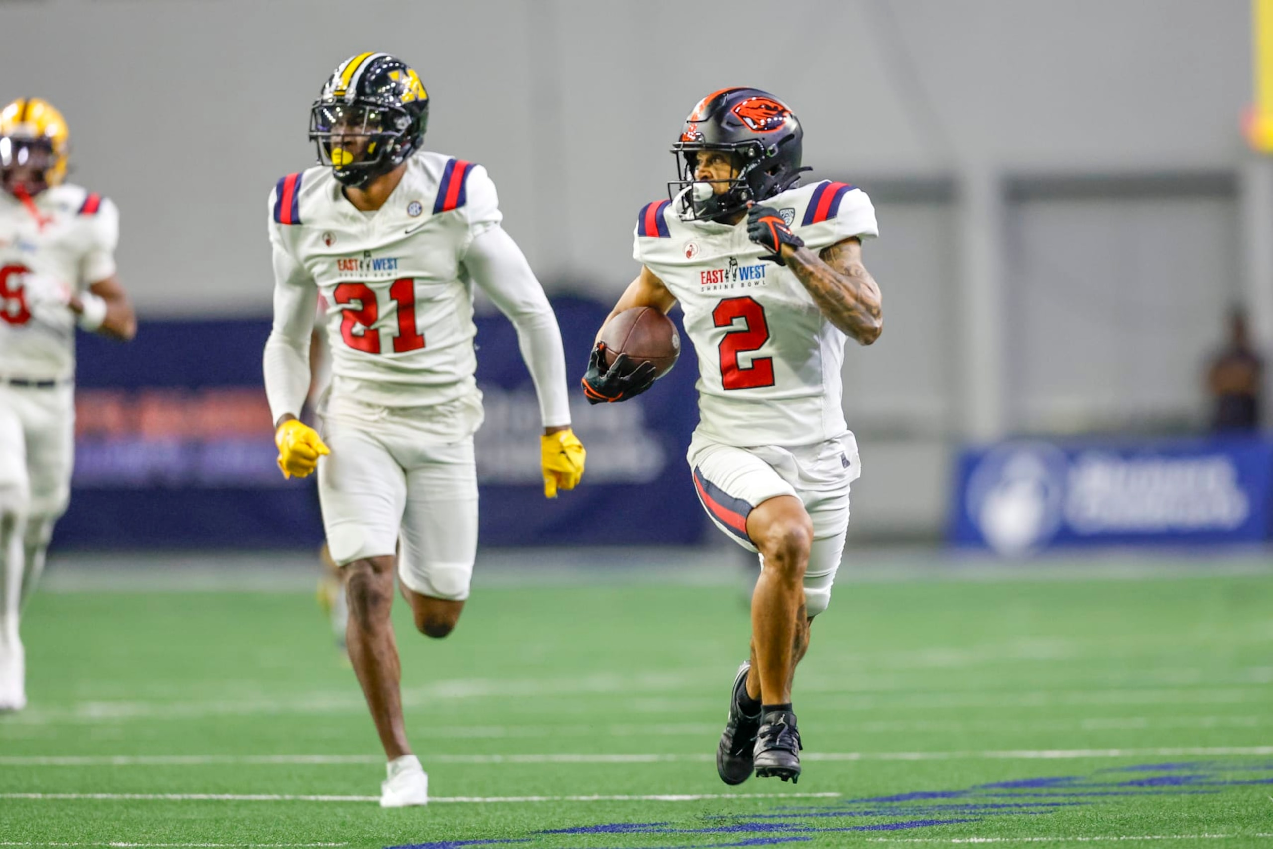 FRISCO, TX - FEBRUARY 01: East Team wide receiver Anthony Gould (2) runs for a touchdown followed by East Team safety Jaylon Carlies (21) during the East-West Shrine Bowl on February 1, 2024 at the Ford Center at The Star in Frisco, Texas. (Photo by Matthew Pearce/Icon Sportswire via Getty Images)