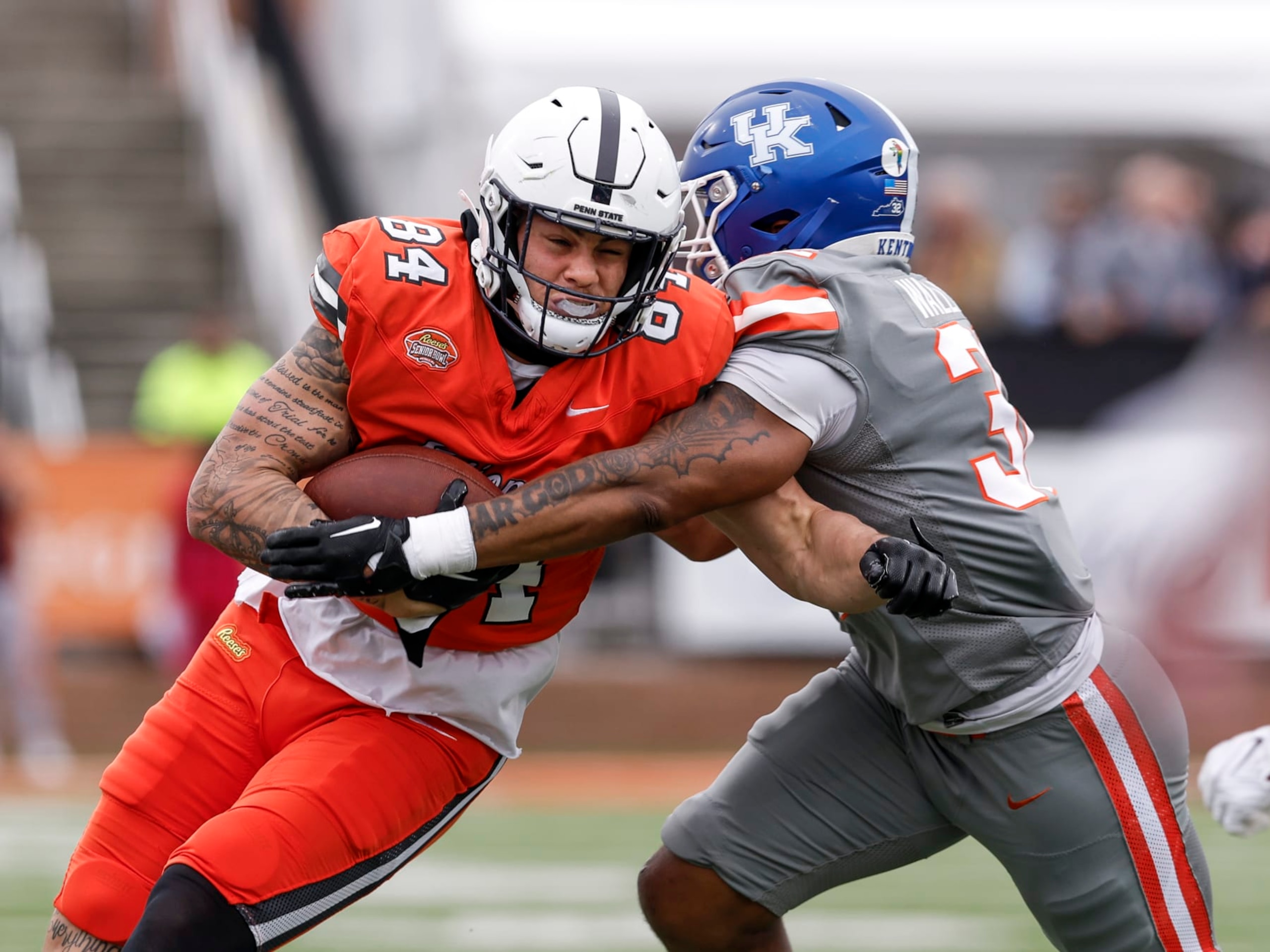 MOBILE, AL - FEBRUARY 03: Tight End Theo Johnson #84 of Penn State from the National Team is forced out of bounds by Linebacker Trevin Wallace #32 of Kentucky from the American Team after a catch and run during the 2024 Reese's Senior Bowl at Hancock Whitney Stadium on the campus of the University of South Alabama on February 3, 2024 in Mobile, Alabama. he National Team defeated the American Team 16 to 7. (Photo by Don Juan Moore/Getty Images)