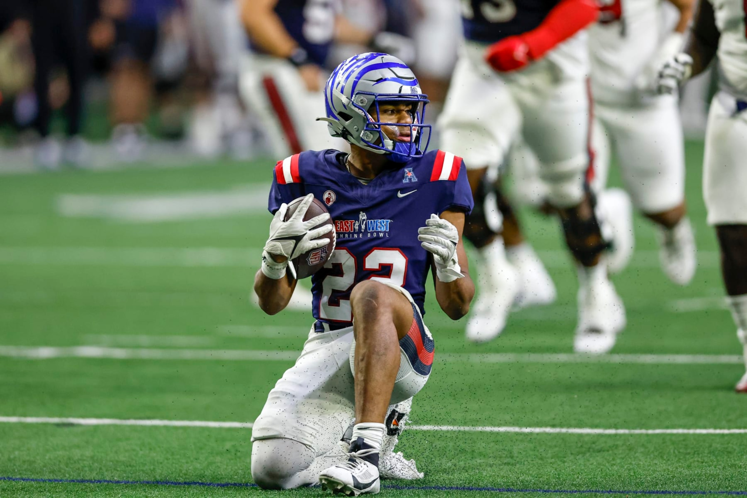 FRISCO, TX - FEBRUARY 01: West Team running back Blake Watson (22) takes a knee during the East-West Shrine Bowl on February 1, 2024 at the Ford Center at The Star in Frisco, Texas. (Photo by Matthew Pearce/Icon Sportswire via Getty Images)