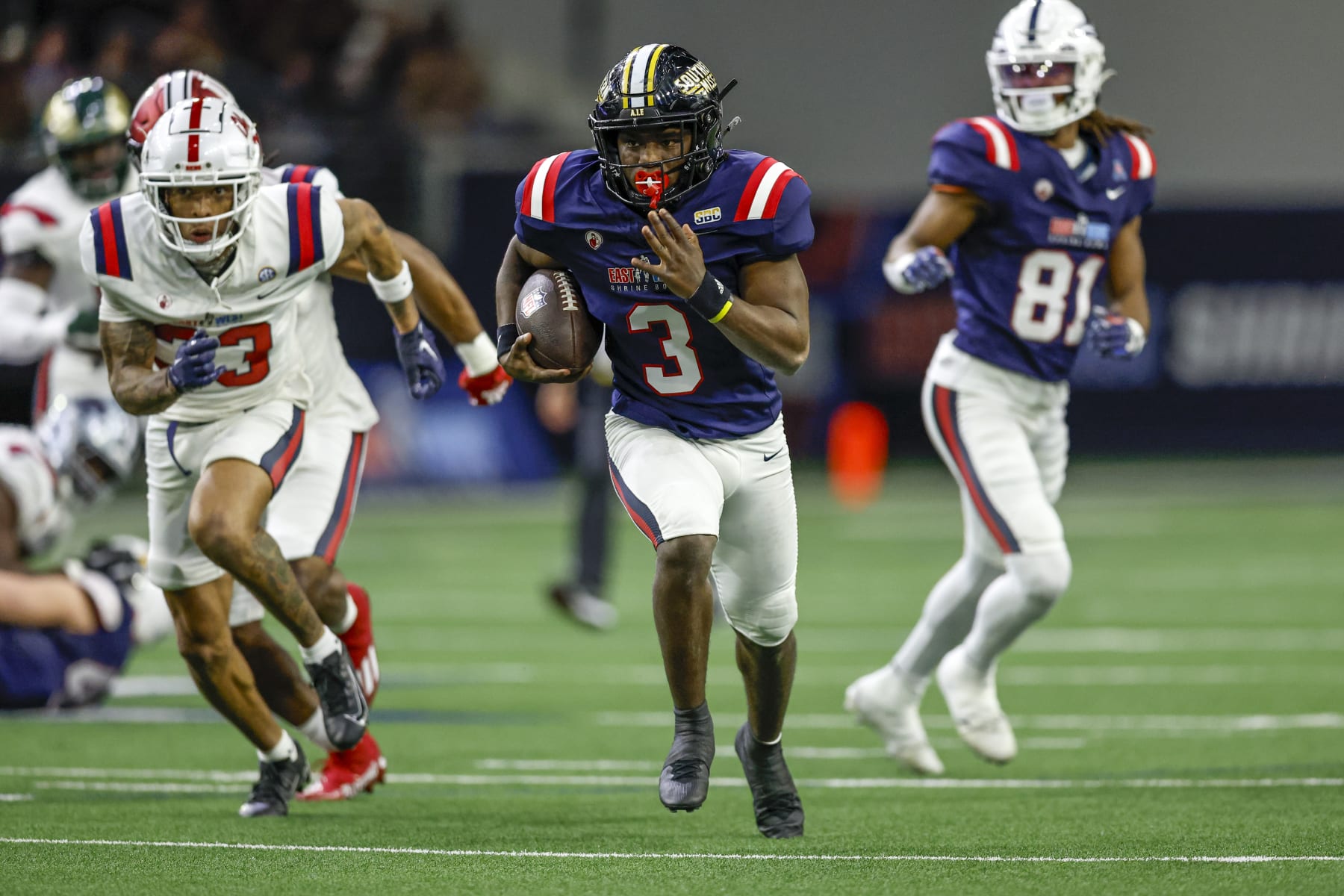 FRISCO, TX - FEBRUARY 01: West Team running back Frank Gore Jr. (3) runs through a hole in the line of scrimmage during the East-West Shrine Bowl on February 1, 2024 at the Ford Center at The Star in Frisco, Texas. (Photo by Matthew Pearce/Icon Sportswire via Getty Images)