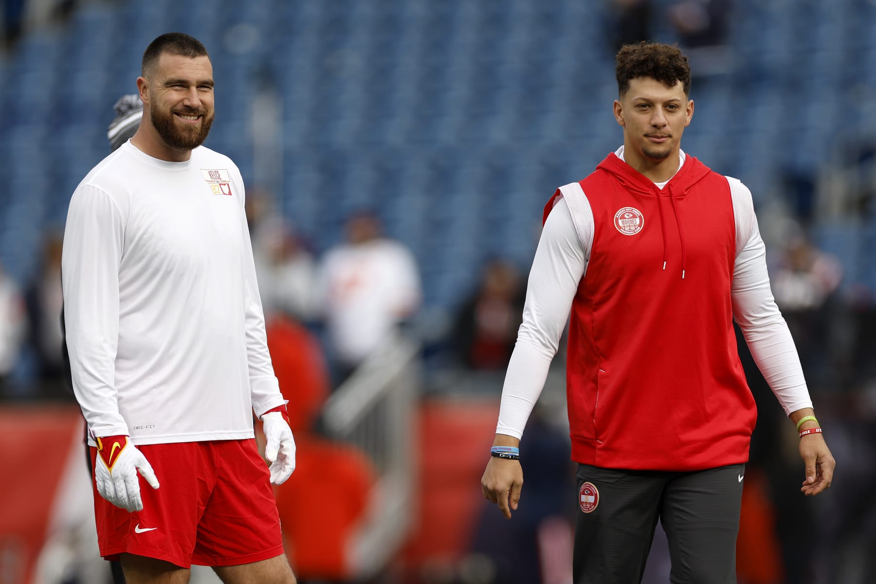 FOXBOROUGH, MASSACHUSETTS - DECEMBER 17: Travis Kelce #87 and Patrick Mahomes #15 of the Kansas City Chiefs look on prior to a game against the New England Patriots at Gillette Stadium on December 17, 2023 in Foxborough, Massachusetts. (Photo by Sarah Stier/Getty Images)