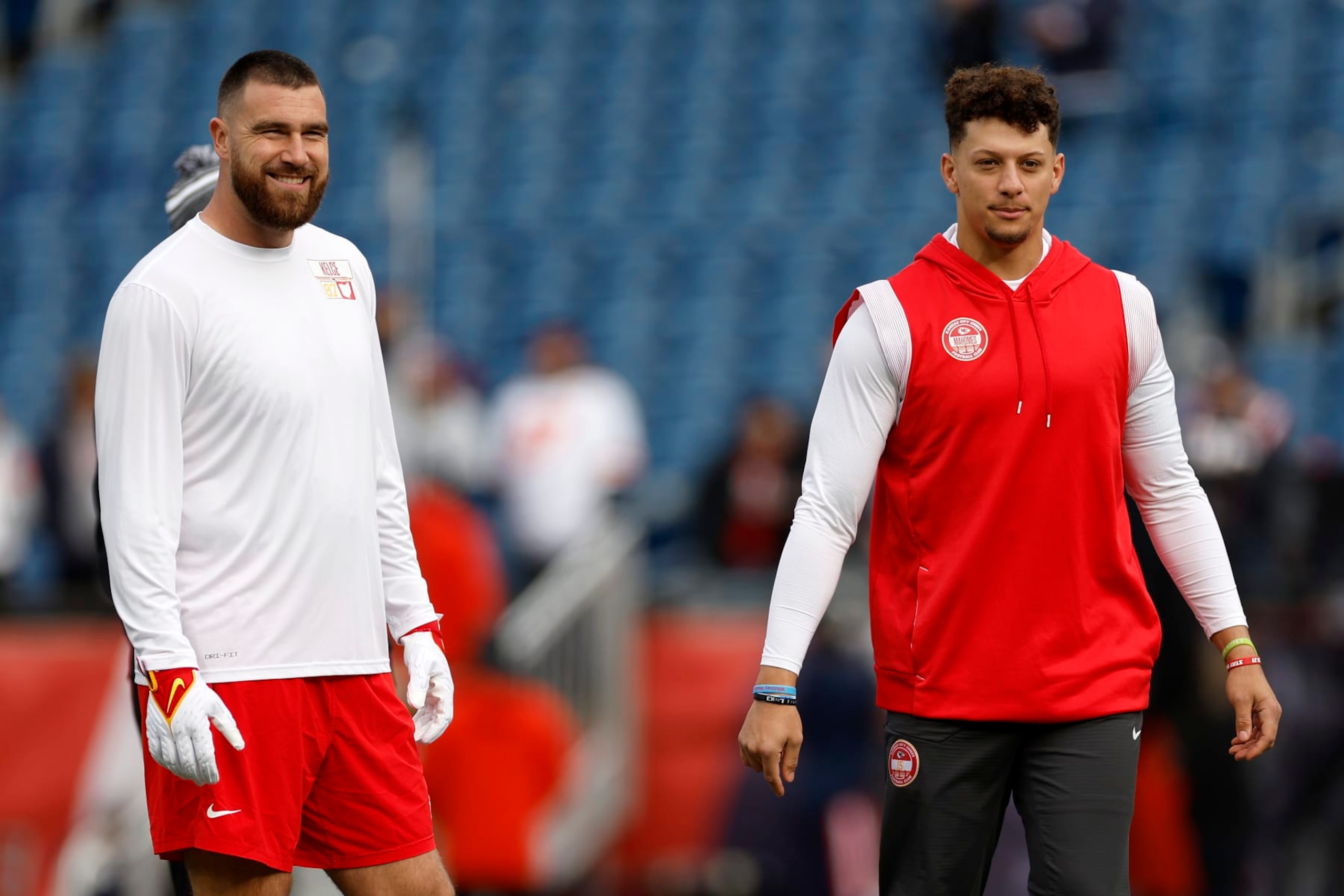 FOXBOROUGH, MASSACHUSETTS - DECEMBER 17: Travis Kelce #87 and Patrick Mahomes #15 of the Kansas City Chiefs look on prior to a game against the New England Patriots at Gillette Stadium on December 17, 2023 in Foxborough, Massachusetts. (Photo by Sarah Stier/Getty Images)