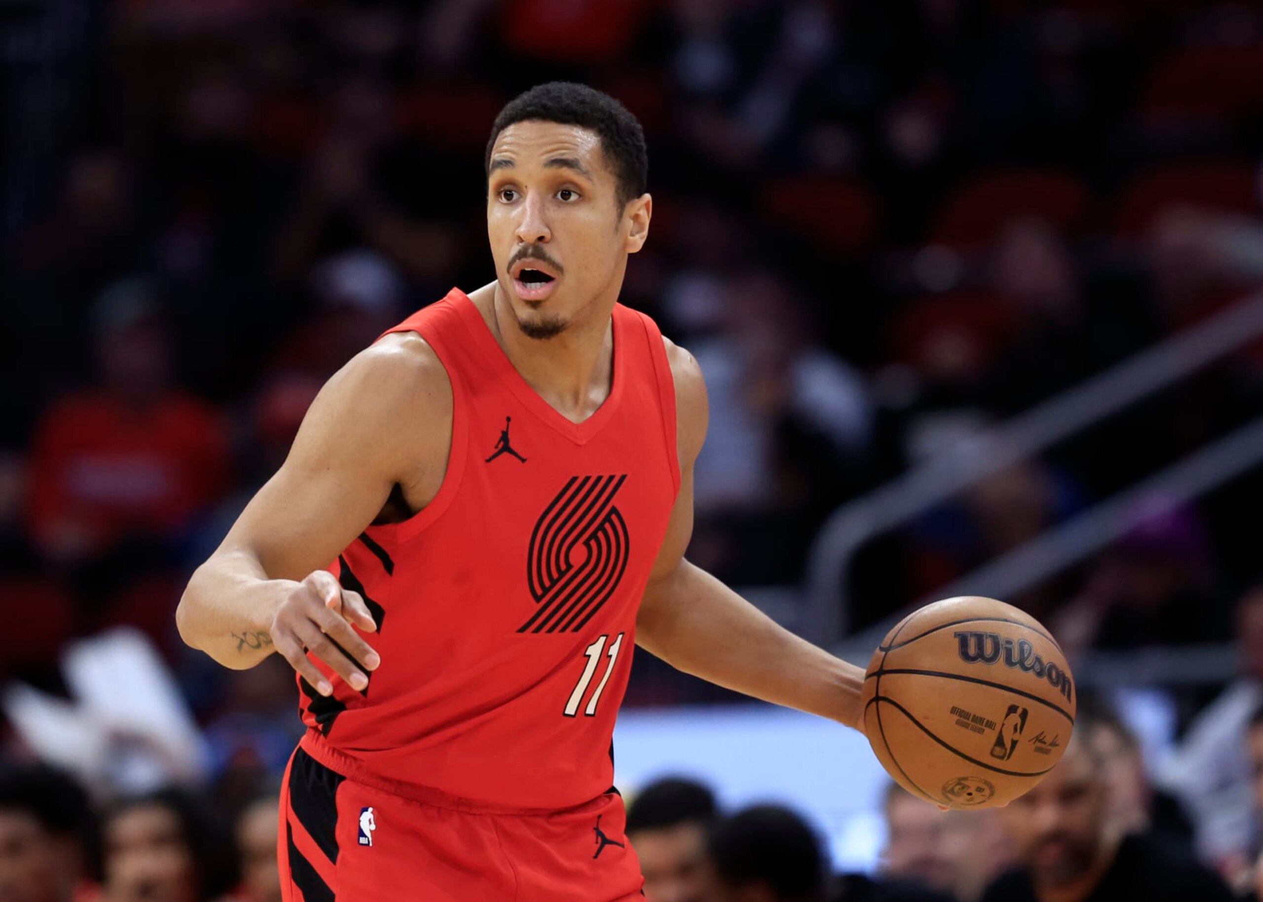 HOUSTON, TEXAS - JANUARY 24: Malcolm Brogdon #11 of the Portland Trail Blazers in action against the Houston Rockets during the first half at Toyota Center on January 24, 2024 in Houston, Texas. (Photo by Carmen Mandato/Getty Images)