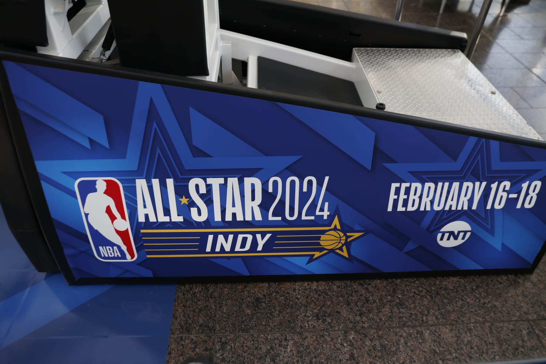 INDIANAPOLIS, IN - FEBRUARY 3: Signage displayed on a basketball goal located on a basketball court built inside the Indianapolis International Airport terminal to commemorate the 2024 NBA Allstar game as seen on February 3, 2024, before the 2024 NBA Allstar Game is played at Gainbridge Fieldhouse in Indianapolis, Indiana. (Photo by Brian Spurlock/Icon Sportswire via Getty Images)