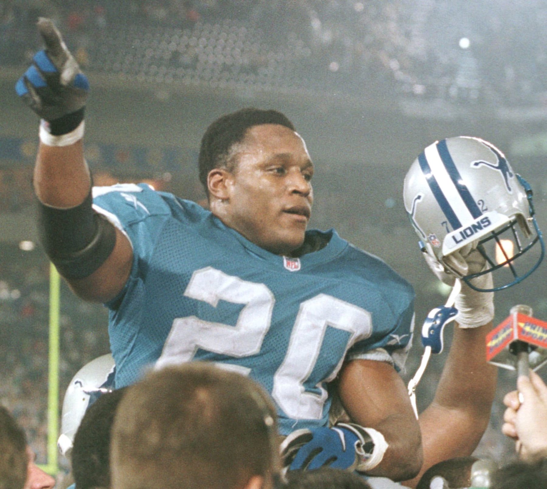 Detroit Lions running back Barry Sanders is carried off the field at the end of the game 21 December after his 184-yard rushing performance put his season total at 2,053 yards. Sanders now has 13,778 career yards, second only to former Chicago Bears player Walter Payton. The Lions beat the Jets 13-10. The Lions advanced to the NFL playoffs and the Jets were eliminated. AFP PHOTO/Matt CAMPBELL (Photo by MATT CAMPBELL / AFP)        (Photo credit should read MATT CAMPBELL/AFP via Getty Images)