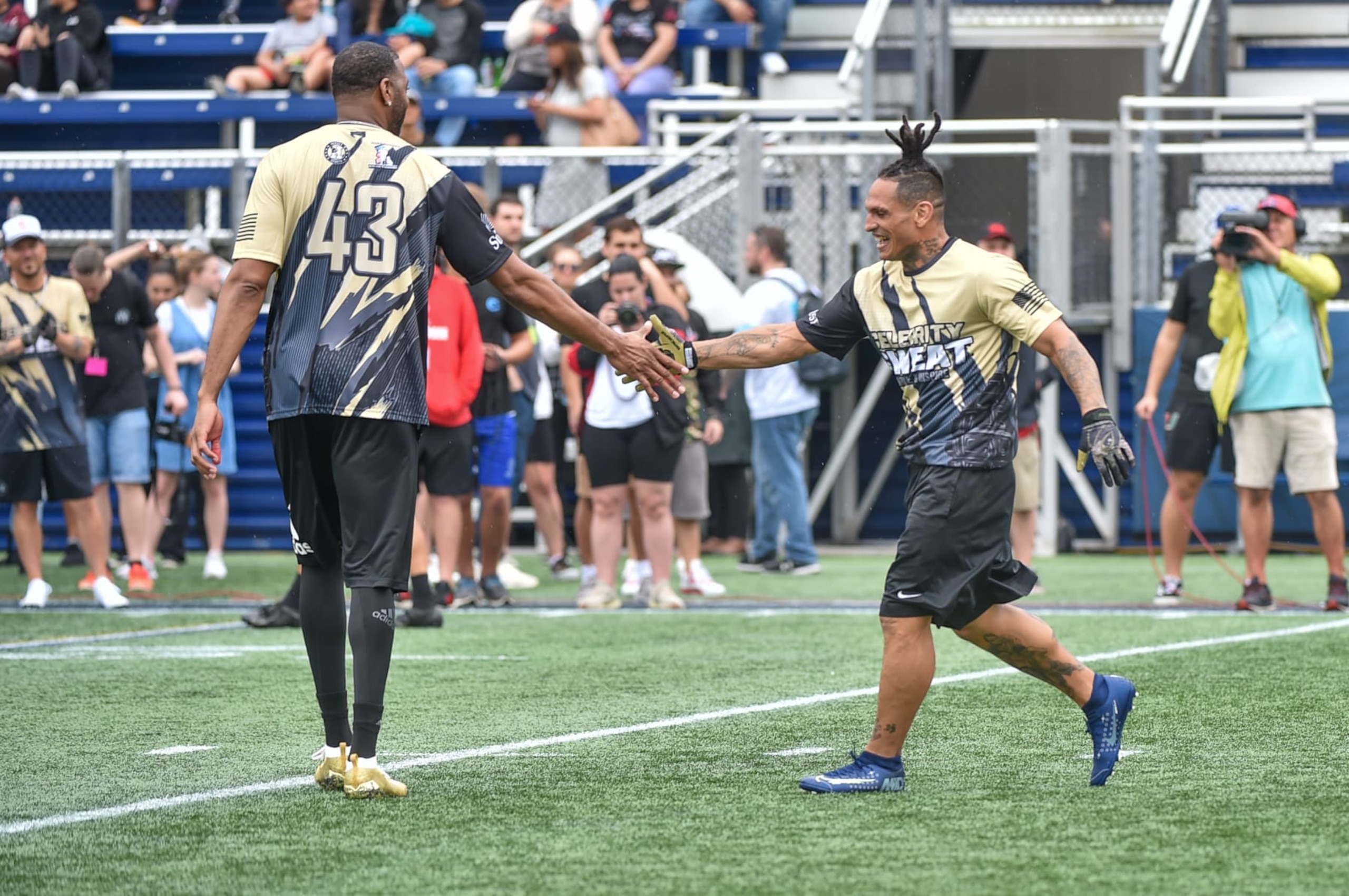 MIAMI, FLORIDA - FEBRUARY 01: Former NBA Player Tracy McGrady celebrates with Ulysses Diaz at the 20th Annual Super Bowl Celebrity Sweat Flag Football Challenge at Riccardo Silva Stadium on February 01, 2020 in Miami, Florida. (Photo by Aaron J. Thornton/Getty Images)
