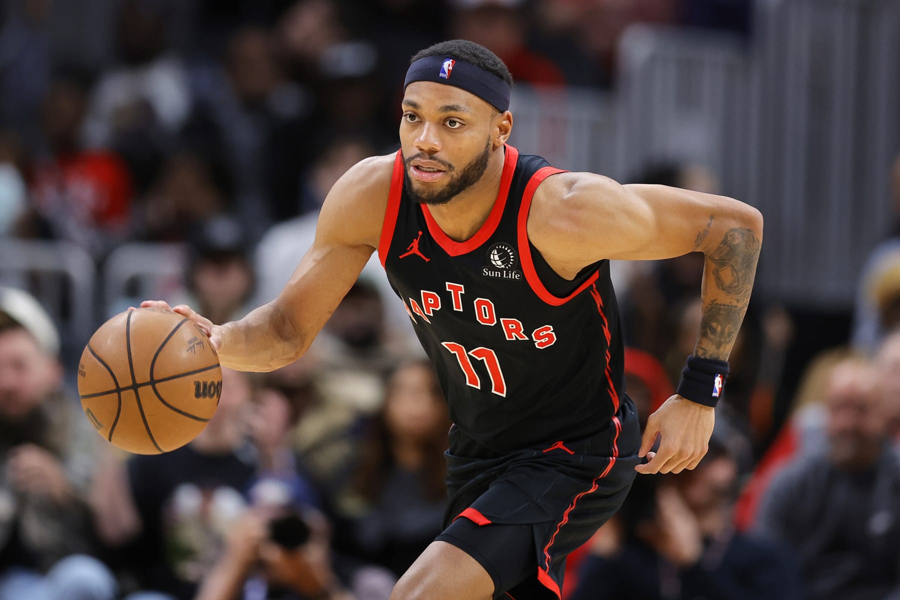 ATLANTA, GEORGIA - JANUARY 28: Bruce Brown #11 of the Toronto Raptors drives down court against the Atlanta Hawks during the second half at State Farm Arena on January 28, 2024 in Atlanta, Georgia. NOTE TO USER: User expressly acknowledges and agrees that, by downloading and or using this photograph, User is consenting to the terms and conditions of the Getty Images License Agreement. (Photo by Alex Slitz/Getty Images)