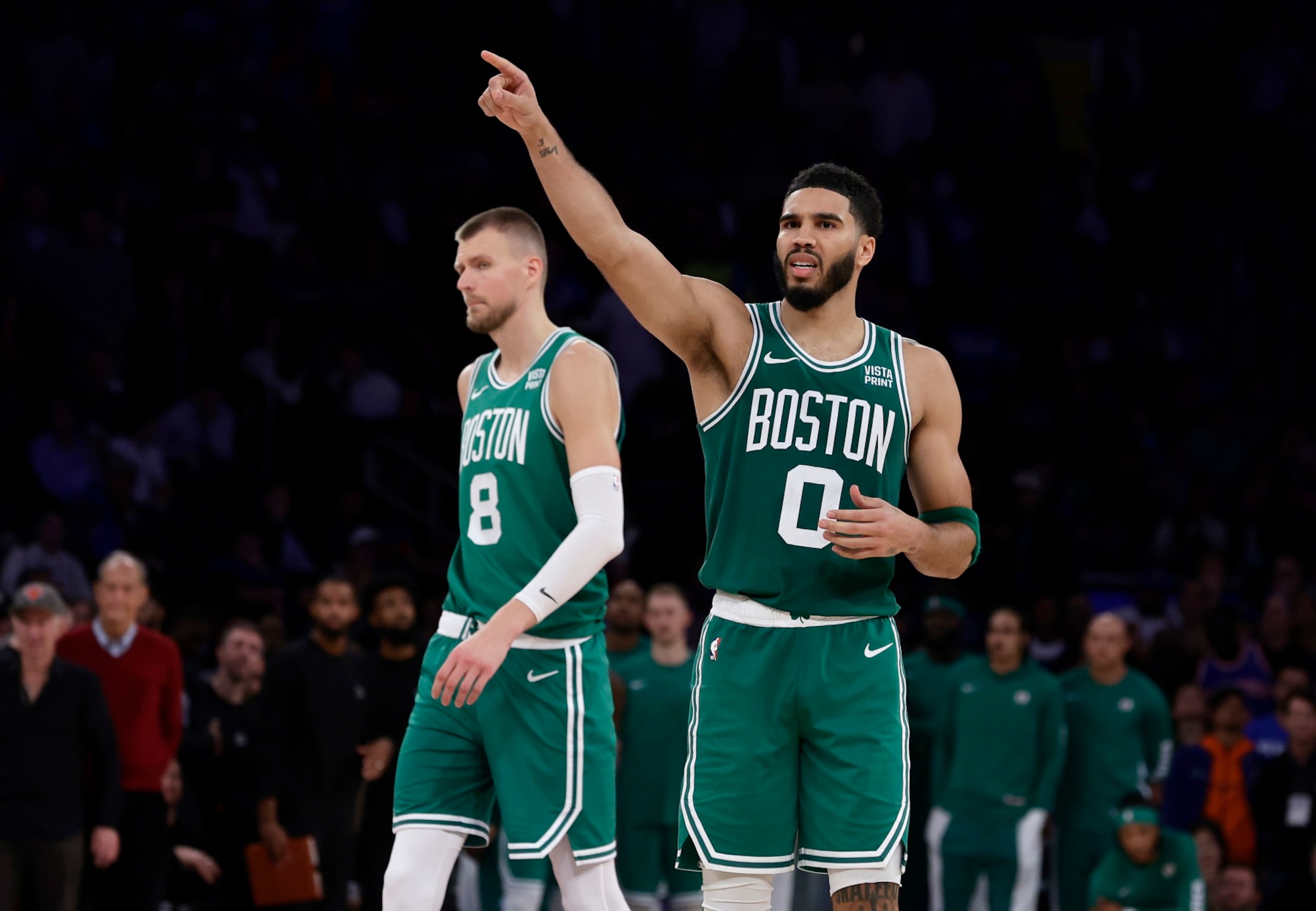NEW YORK, NEW YORK - OCTOBER 25: (NEW YORK DAILIES OUT) Jayson Tatum #0 and Kristaps Porzingis #8 of the Boston Celtics in action against the New York Knicks at Madison Square Garden on October 25, 2023 in New York City. The Celtics defeated the Knicks 108-104. NOTE TO USER: User expressly acknowledges and agrees that, by downloading and or using this photograph, User is consenting to the terms and conditions of the Getty Images License Agreement. (Photo by Jim McIsaac/Getty Images) NEW YORK, NEW YORK - OCTOBER 25: (NEW YORK DAILIES OUT) Jayson Tatum #0 and Kristaps Porzingis #8 of the Boston Celtics in action against the New York Knicks at Madison Square Garden on October 25, 2023 in New York City. The Celtics defeated the Knicks 108-104. NOTE TO USER: User expressly acknowledges and agrees that, by downloading and or using this photograph, User is consenting to the terms and conditions of the Getty Images License Agreement. (Photo by Jim McIsaac/Getty Images)