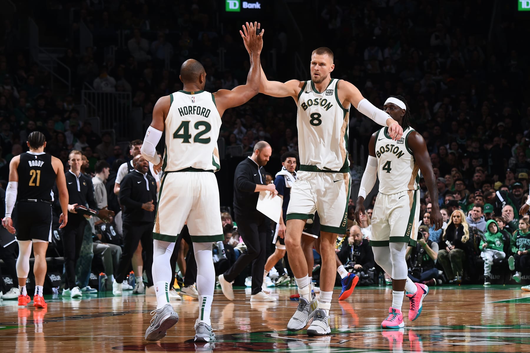 BOSTON, MA - FEBRUARY 4:  Al Horford #42 high five during the game Kristaps Porzingis #8 of the Boston Celtics during the game against the Memphis Grizzlies on February 4, 2024 at the TD Garden in Boston, Massachusetts. NOTE TO USER: User expressly acknowledges and agrees that, by downloading and or using this photograph, User is consenting to the terms and conditions of the Getty Images License Agreement. Mandatory Copyright Notice: Copyright 2024 NBAE  (Photo by Brian Babineau/NBAE via Getty Images)