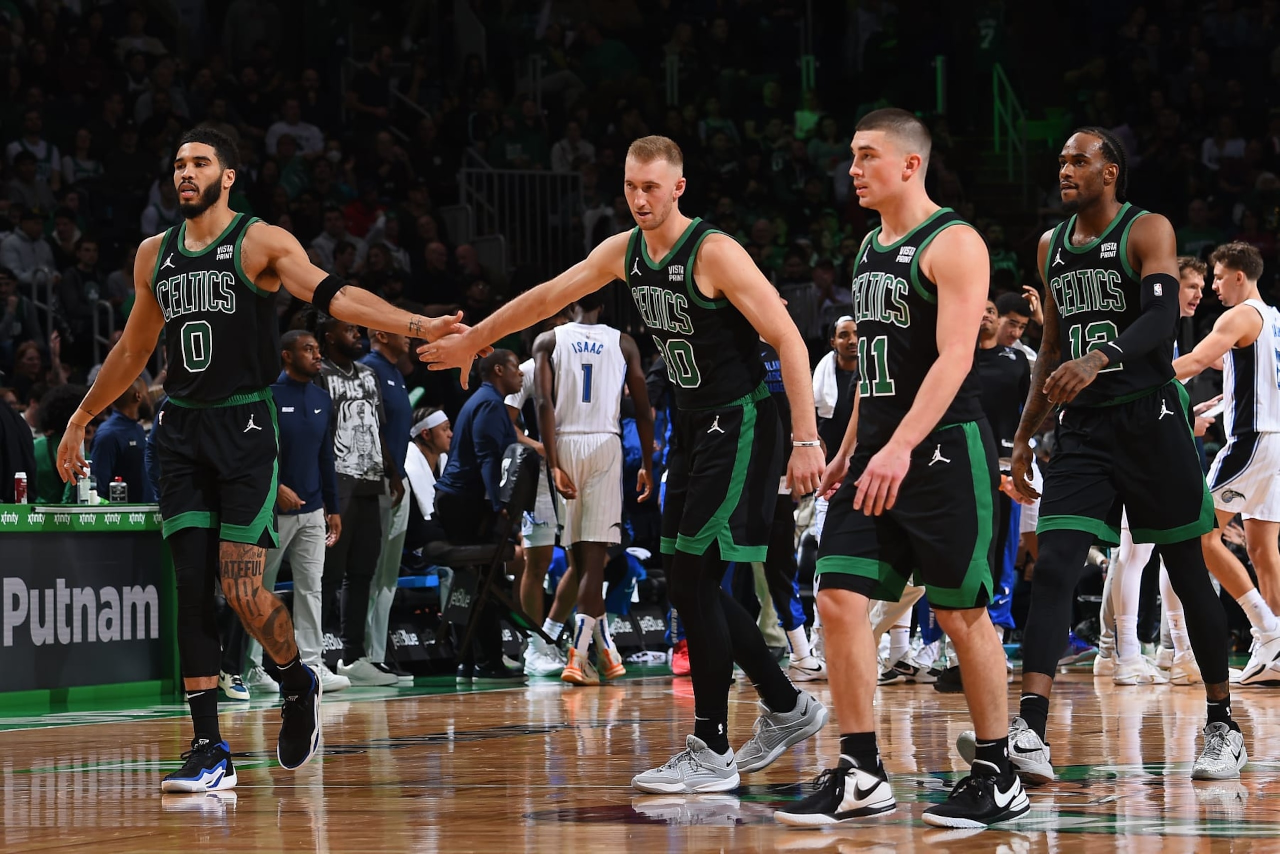 BOSTON, MA - DECEMBER 15: Jayson Tatum #0 and Sam Hauser #30 of the Boston Celtics high five during the game against the Orlando Magic on December 15, 2023 at the TD Garden in Boston, Massachusetts. NOTE TO USER: User expressly acknowledges and agrees that, by downloading and or using this photograph, User is consenting to the terms and conditions of the Getty Images License Agreement. Mandatory Copyright Notice: Copyright 2023 NBAE (Photo by Brian Babineau/NBAE via Getty Images) BOSTON, MA - DECEMBER 15: Jayson Tatum #0 and Sam Hauser #30 of the Boston Celtics high five during the game against the Orlando Magic on December 15, 2023 at the TD Garden in Boston, Massachusetts. NOTE TO USER: User expressly acknowledges and agrees that, by downloading and or using this photograph, User is consenting to the terms and conditions of the Getty Images License Agreement. Mandatory Copyright Notice: Copyright 2023 NBAE (Photo by Brian Babineau/NBAE via Getty Images)