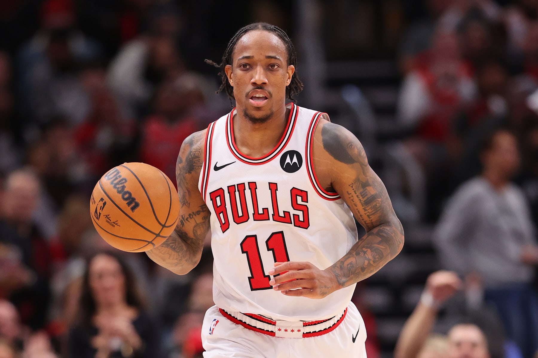 CHICAGO, ILLINOIS - FEBRUARY 03: DeMar DeRozan #11 of the Chicago Bulls dribbles up the court against the Sacramento Kings during the second half at the United Center on February 03, 2024 in Chicago, Illinois. NOTE TO USER: User expressly acknowledges and agrees that, by downloading and or using this photograph, User is consenting to the terms and conditions of the Getty Images License Agreement.  (Photo by Michael Reaves/Getty Images)