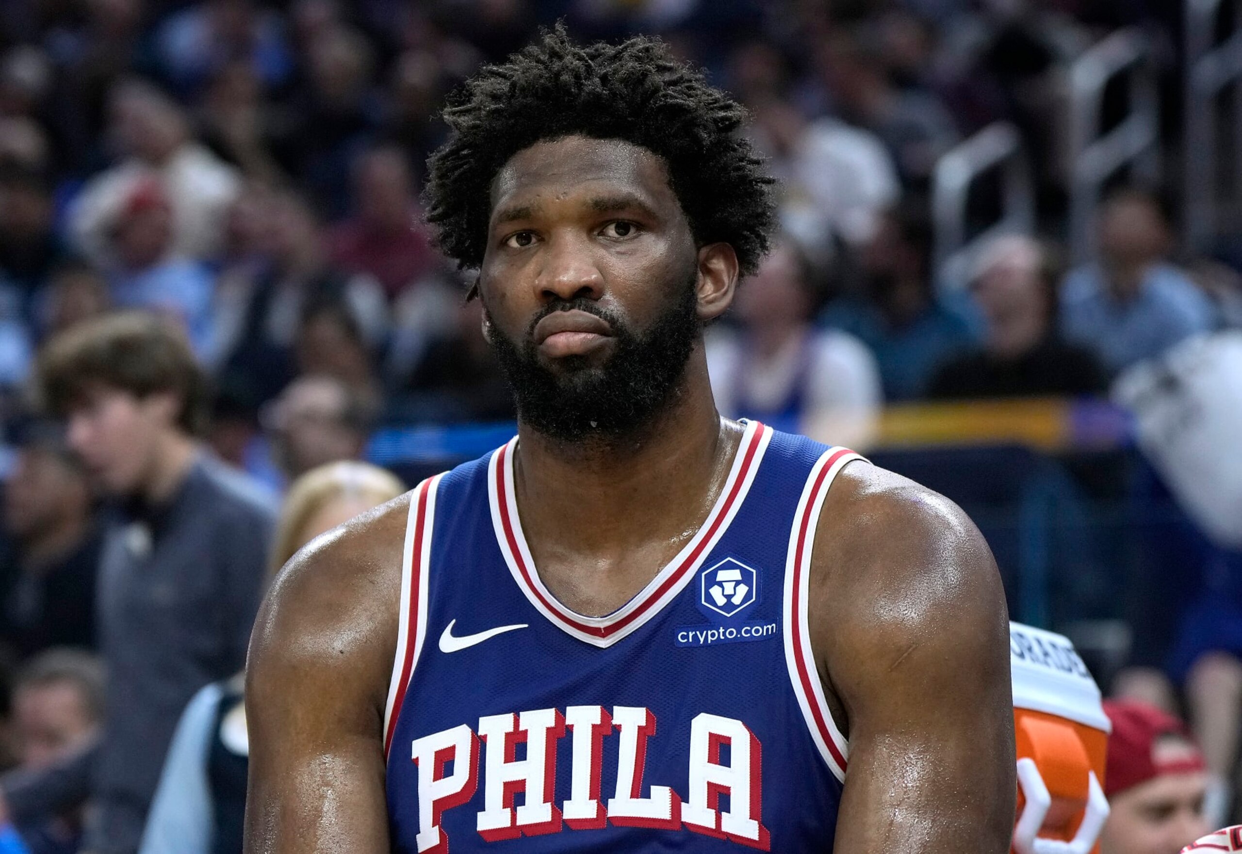 SAN FRANCISCO, CALIFORNIA - JANUARY 30: Joel Embiid #21 of the Philadelphia 76ers looks on from the bench against the Golden State Warriors during the fourth quarter of an NBA basketball game at Chase Center on January 30, 2024 in San Francisco, California. NOTE TO USER: User expressly acknowledges and agrees that, by downloading and or using this photograph, User is consenting to the terms and conditions of the Getty Images License Agreement. (Photo by Thearon W. Henderson/Getty Images)