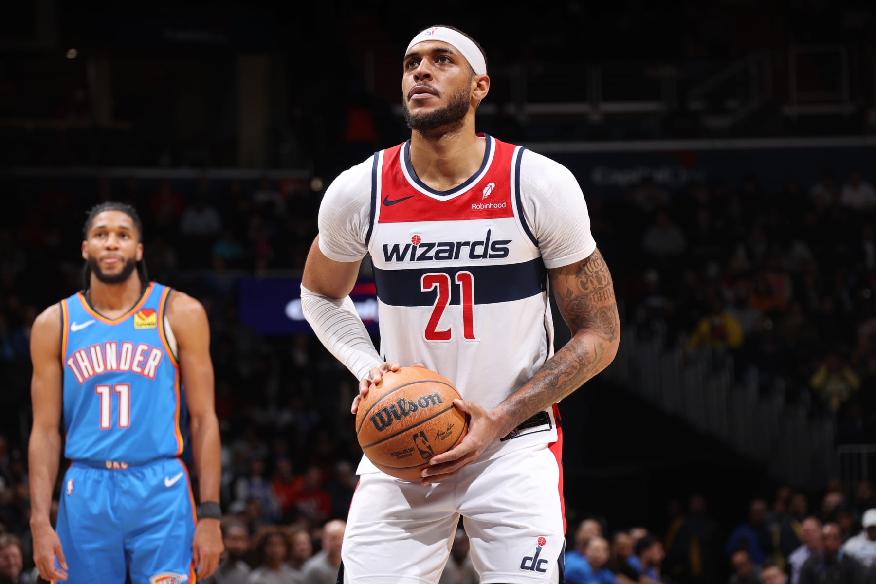 WASHINGTON, DC -  JANUARY 8: Daniel Gafford #21 of the Washington Wizards shoots a free throw during the game against the Oklahoma City Thunder on January 8, 2024 at Capital One Arena in Washington, DC. NOTE TO USER: User expressly acknowledges and agrees that, by downloading and or using this Photograph, user is consenting to the terms and conditions of the Getty Images License Agreement. Mandatory Copyright Notice: Copyright 2024 NBAE (Photo by Stephen Gosling/NBAE via Getty Images)