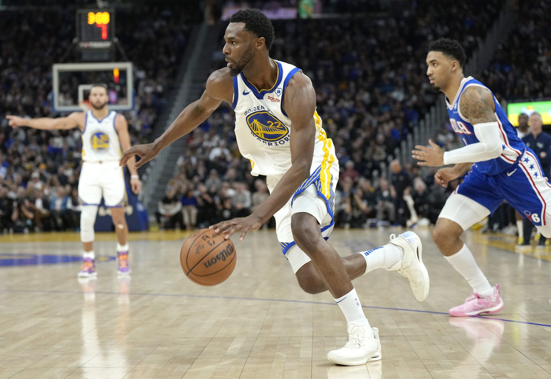 SAN FRANCISCO, CALIFORNIA - JANUARY 30: Andrew Wiggins #22 of the Golden State Warriors drives to the basket past KJ Martin #1 of the Philadelphia 76ers during the third quarter of an NBA basketball game at Chase Center on January 30, 2024 in San Francisco, California. NOTE TO USER: User expressly acknowledges and agrees that, by downloading and or using this photograph, User is consenting to the terms and conditions of the Getty Images License Agreement. (Photo by Thearon W. Henderson/Getty Images)