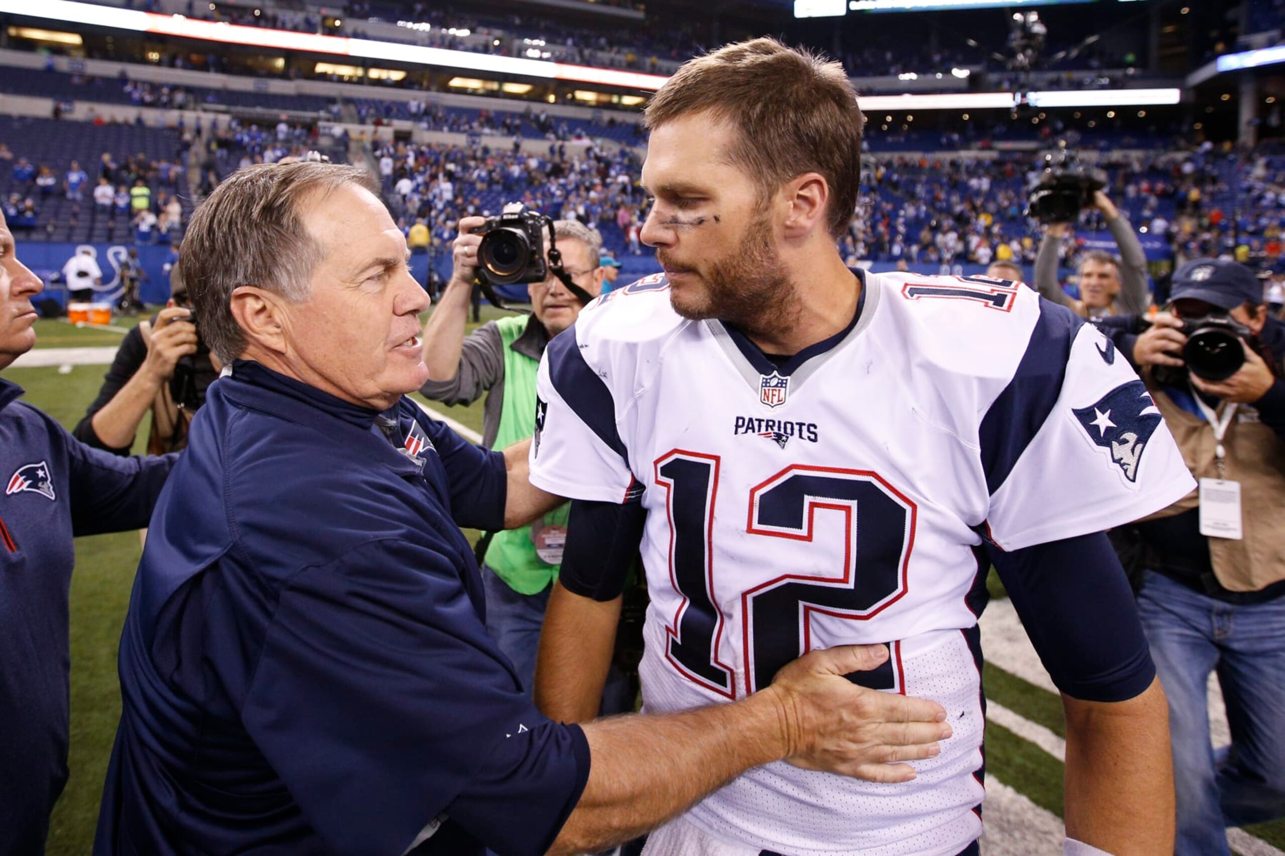 INDIANAPOLIS, IN - OCTOBER 18: Head coach Bill Belichick and Tom Brady #12 of the New England Patriots congratulate each other after the game against the Indianapolis Colts at Lucas Oil Stadium on October 18, 2015 in Indianapolis, Indiana. The Patriots defeated the Colts 34-27. (Photo by Joe Robbins/Getty Images)