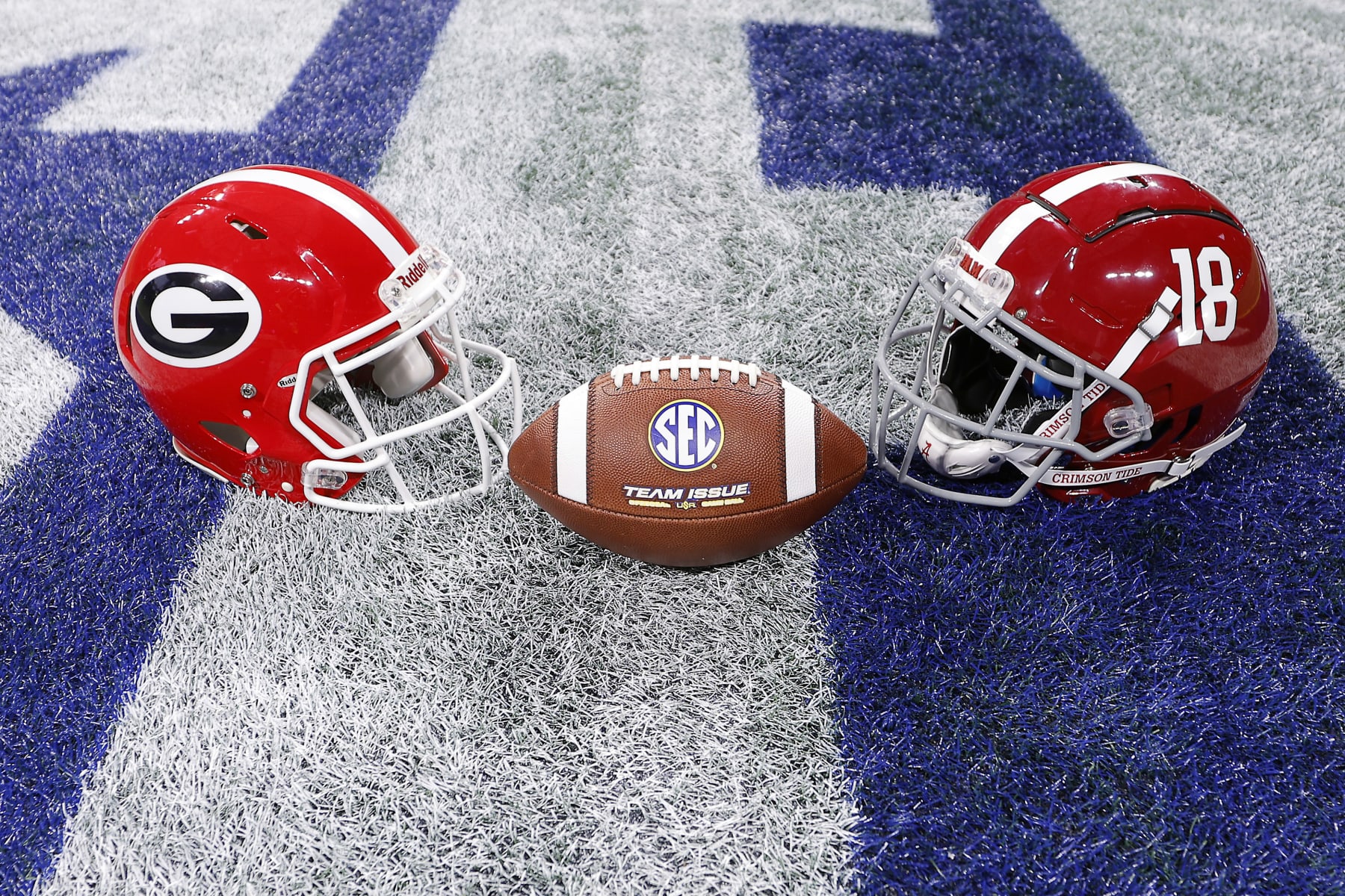 ATLANTA, GEORGIA - DECEMBER 02: A general view of the Alabama Crimson Tide and Georgia Bulldogs helmets at centerfield prior to the SEC Championship game at Mercedes-Benz Stadium on December 02, 2023 in Atlanta, Georgia. (Photo by Todd Kirkland/Getty Images)