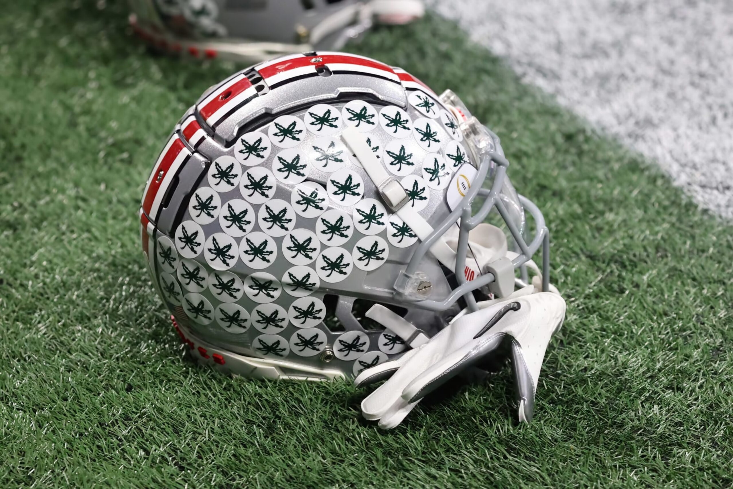 ATLANTA, GA - DECEMBER 31:  Ohio State Buckeyes helmets sit on the ground prior to the college football Playoff Semifinal game at the Chick-fil-a Peach Bowl between the Georgia Bulldogs and the Ohio State Buckeyes on December 31, 2022 at Mercedes-Benz Stadium in Atlanta, Georgia.  (Photo by Michael Wade/Icon Sportswire via Getty Images)