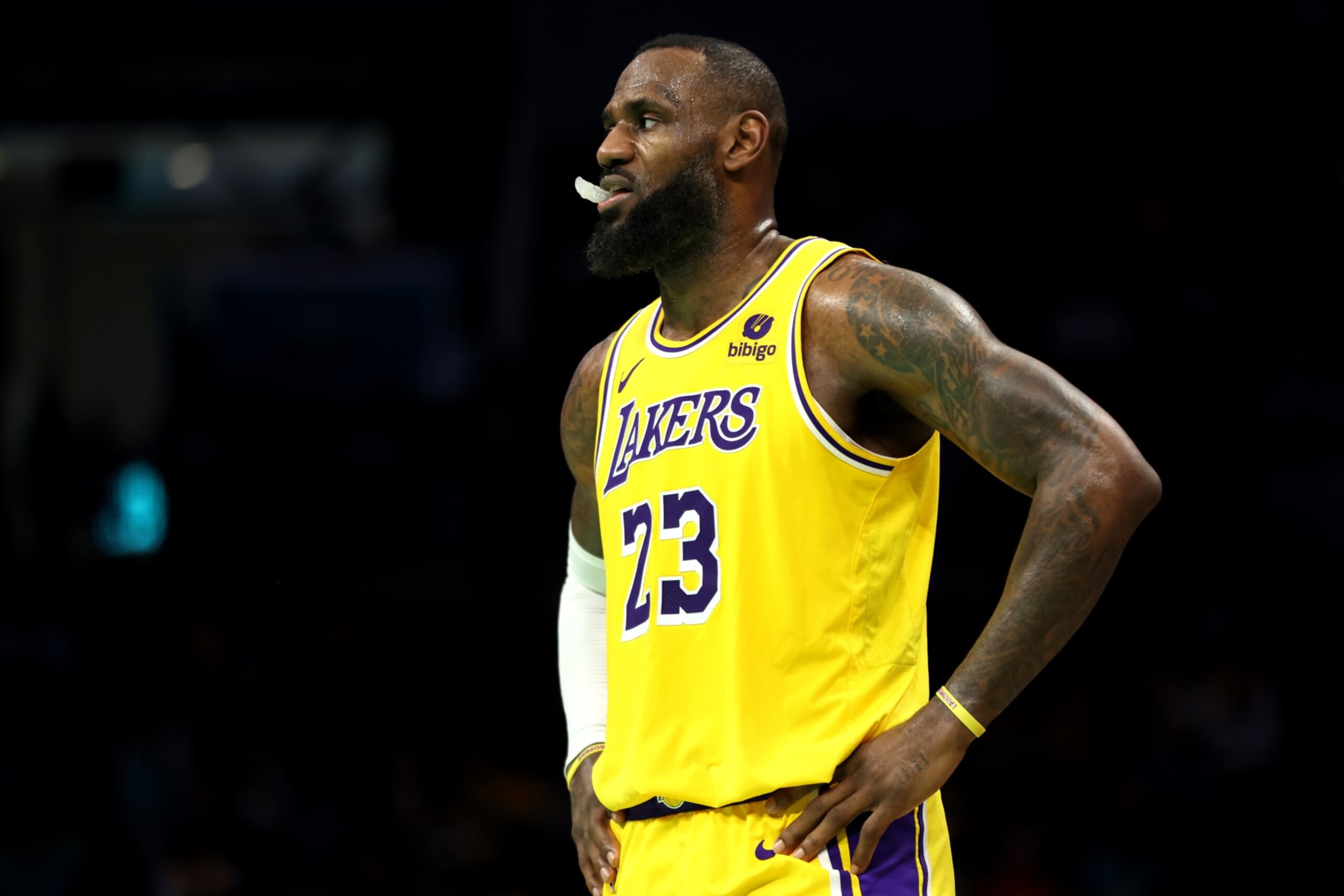 CHARLOTTE, NORTH CAROLINA - FEBRUARY 05: LeBron James #23 of the Los Angeles Lakers looks on during the second half of a game against the Charlotte Hornets at Spectrum Center on February 05, 2024 in Charlotte, North Carolina. NOTE TO USER: User expressly acknowledges and agrees that, by downloading and or using this photograph, User is consenting to the terms and conditions of the Getty Images License Agreement. (Photo by David Jensen/Getty Images)