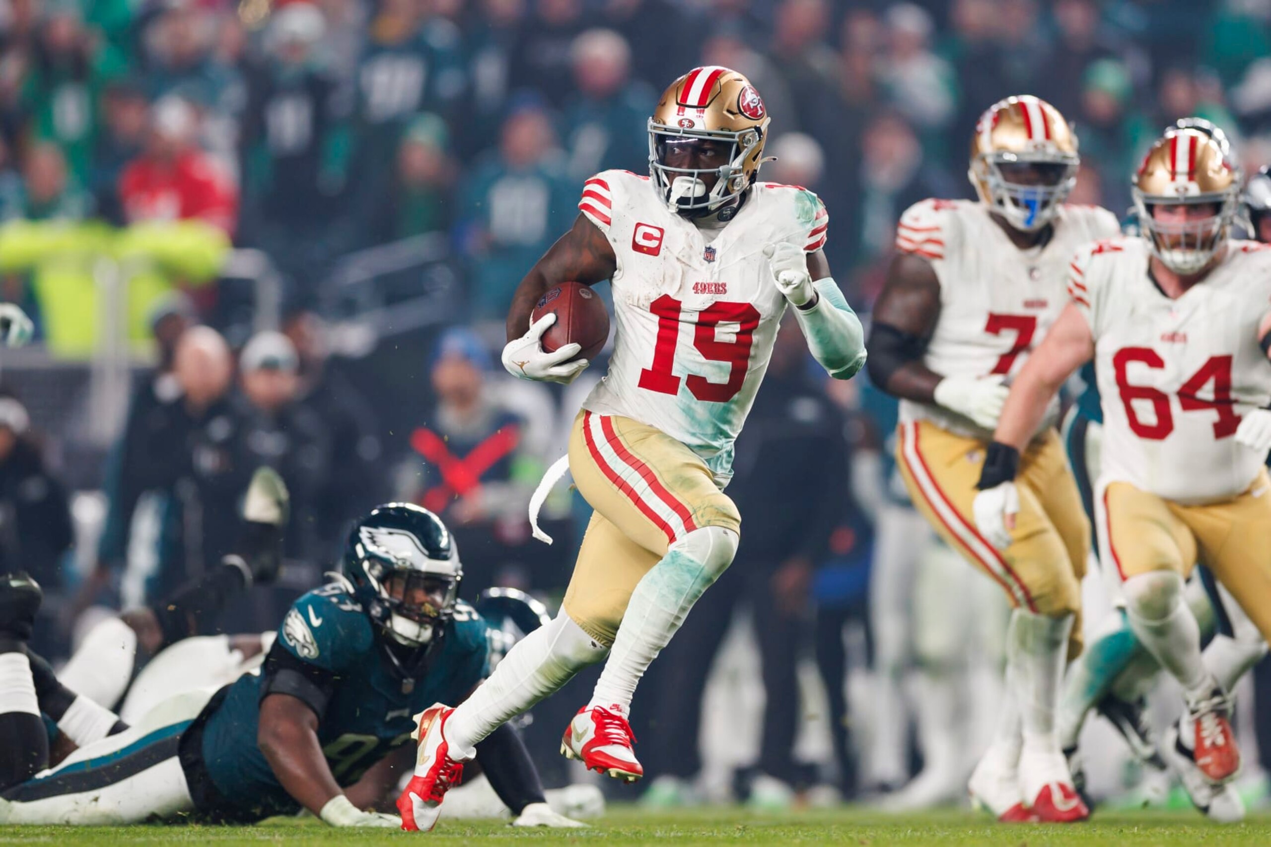 PHILADELPHIA, PENNSYLVANIA - DECEMBER 03: Deebo Samuel #19 of the San Francisco 49ers runs the ball after a catch on his way to score a touchdown during an NFL football game against the Philadelphia Eagles at Lincoln Financial Field on December 3, 2023 in Philadelphia, Pennsylvania. (Photo by Ryan Kang/Getty Images)