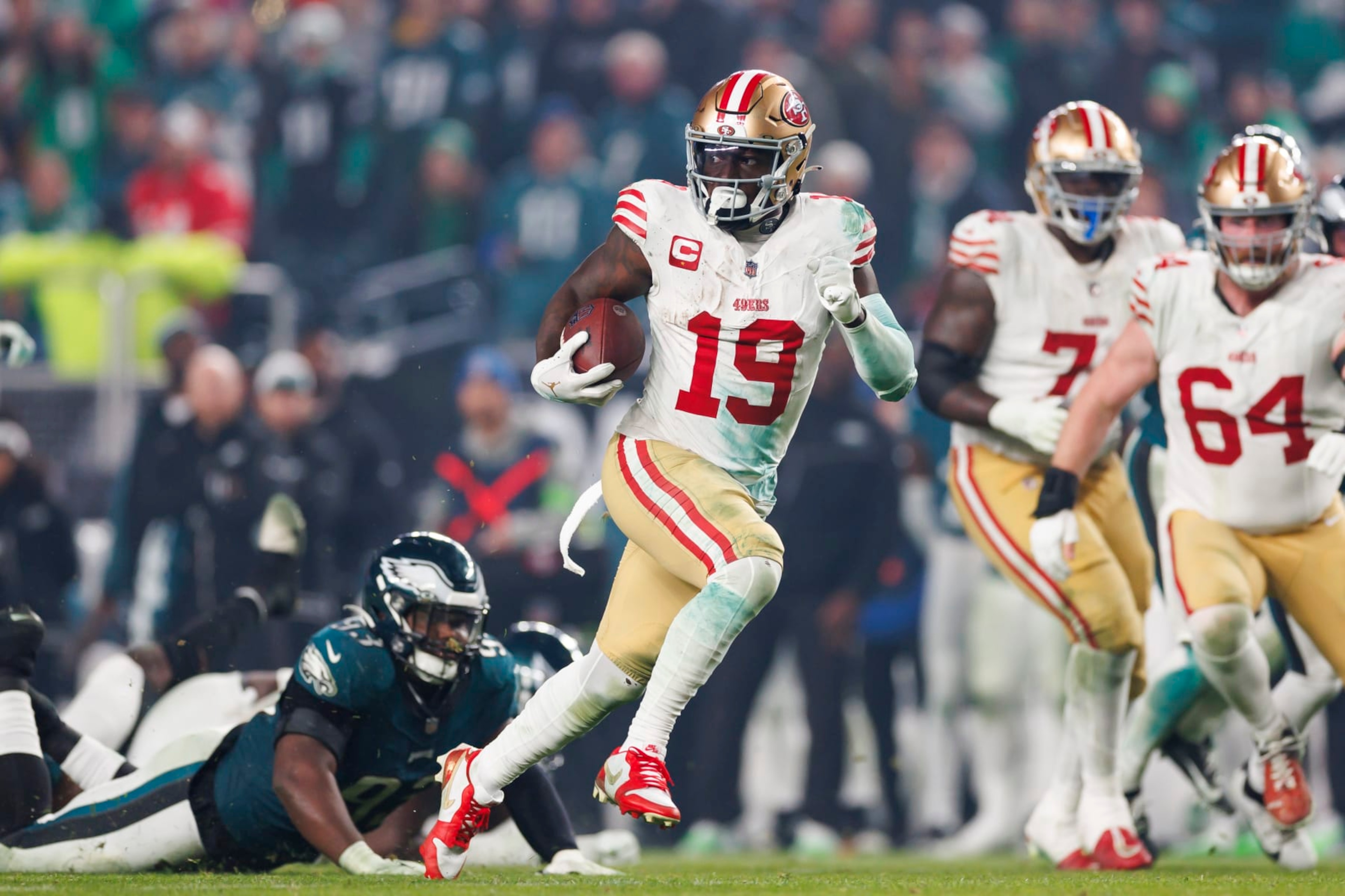 PHILADELPHIA, PENNSYLVANIA - DECEMBER 03: Deebo Samuel #19 of the San Francisco 49ers runs the ball after a catch on his way to score a touchdown during an NFL football game against the Philadelphia Eagles at Lincoln Financial Field on December 3, 2023 in Philadelphia, Pennsylvania. (Photo by Ryan Kang/Getty Images)