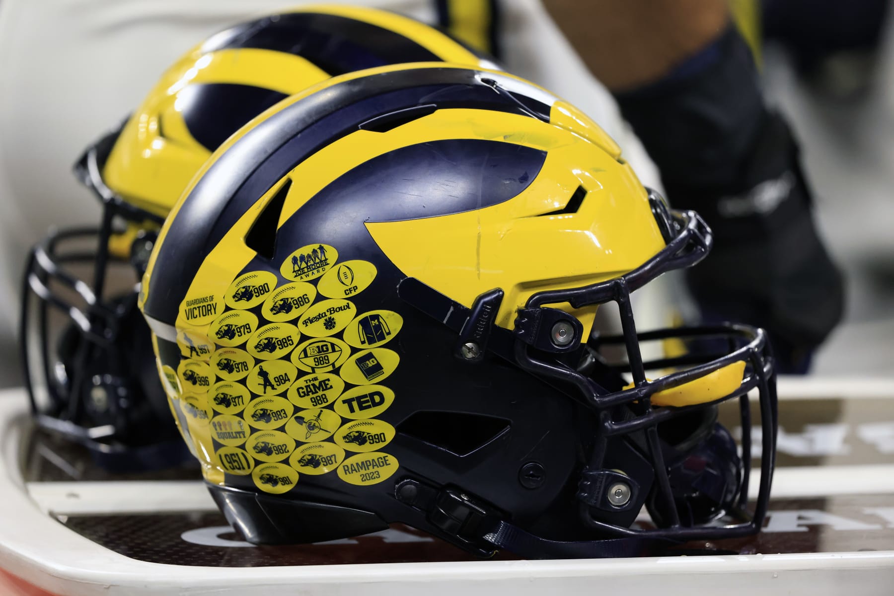 INDIANAPOLIS, INDIANA - DECEMBER 02: A detailed view of the Michigan Wolverine helmet on the sidelines in the game against the Iowa Hawkeyes during the Big Ten Championship at Lucas Oil Stadium on December 02, 2023 in Indianapolis, Indiana. (Photo by Justin Casterline/Getty Images)