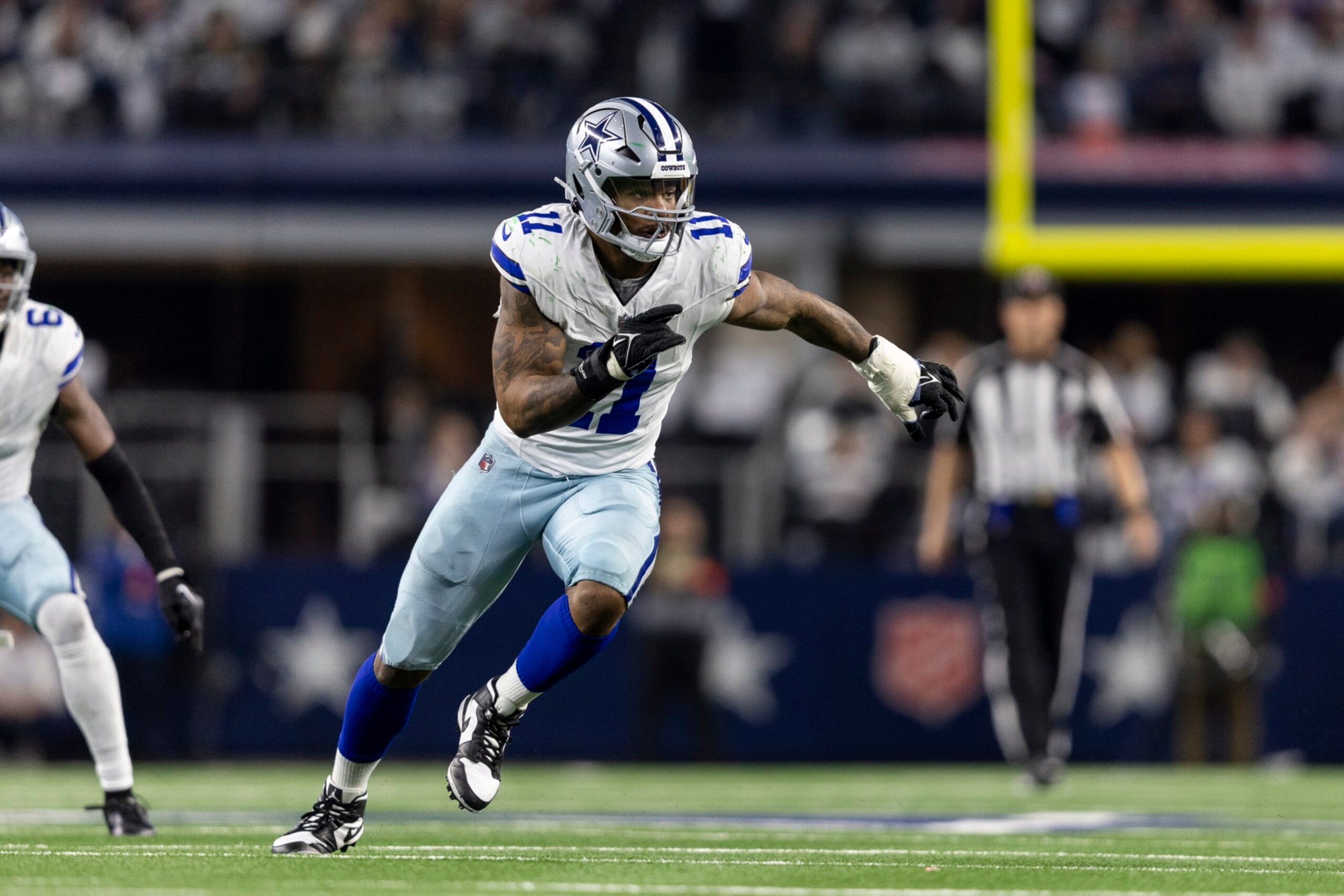 ARLINGTON, TEXAS - JANUARY 14: Micah Parsons #11 of the Dallas Cowboys runs around the edge during an NFL wild-card playoff football game between the Dallas Cowboys and the Green Bay Packers at AT&T Stadium on January 14, 2024 in Arlington, Texas. (Photo by Michael Owens/Getty Images)