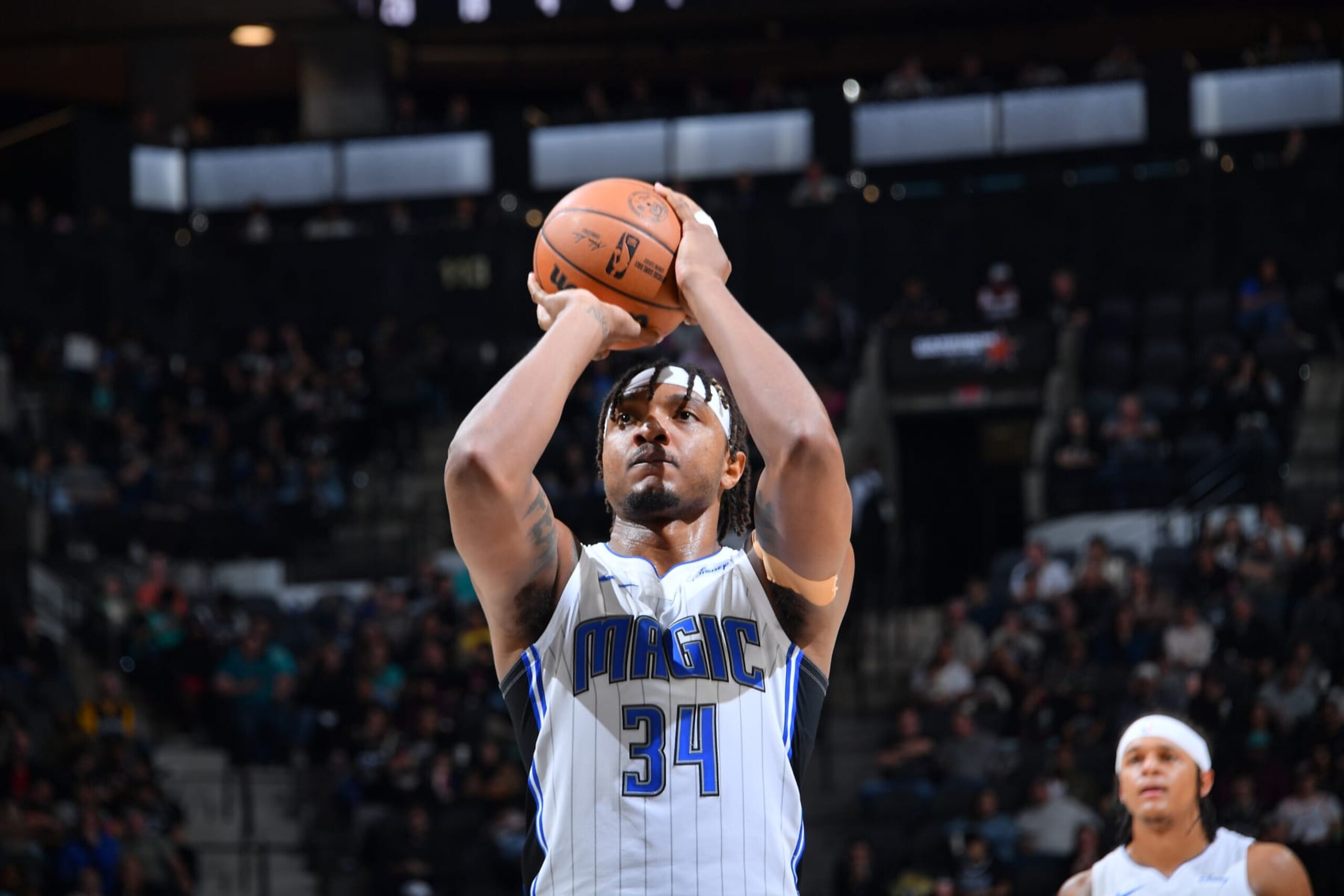 SAN ANTONIO, TX - JANUARY 31: Wendell Carter Jr. #34 of the Orlando Magic shoots a free throw during the game against the San Antonio Spurs on January 31, 2024 at the Frost Bank Center in San Antonio, Texas. NOTE TO USER: User expressly acknowledges and agrees that, by downloading and or using this photograph, user is consenting to the terms and conditions of the Getty Images License Agreement. Mandatory Copyright Notice: Copyright 2024 NBAE (Photos by Michael Gonzales/NBAE via Getty Images)