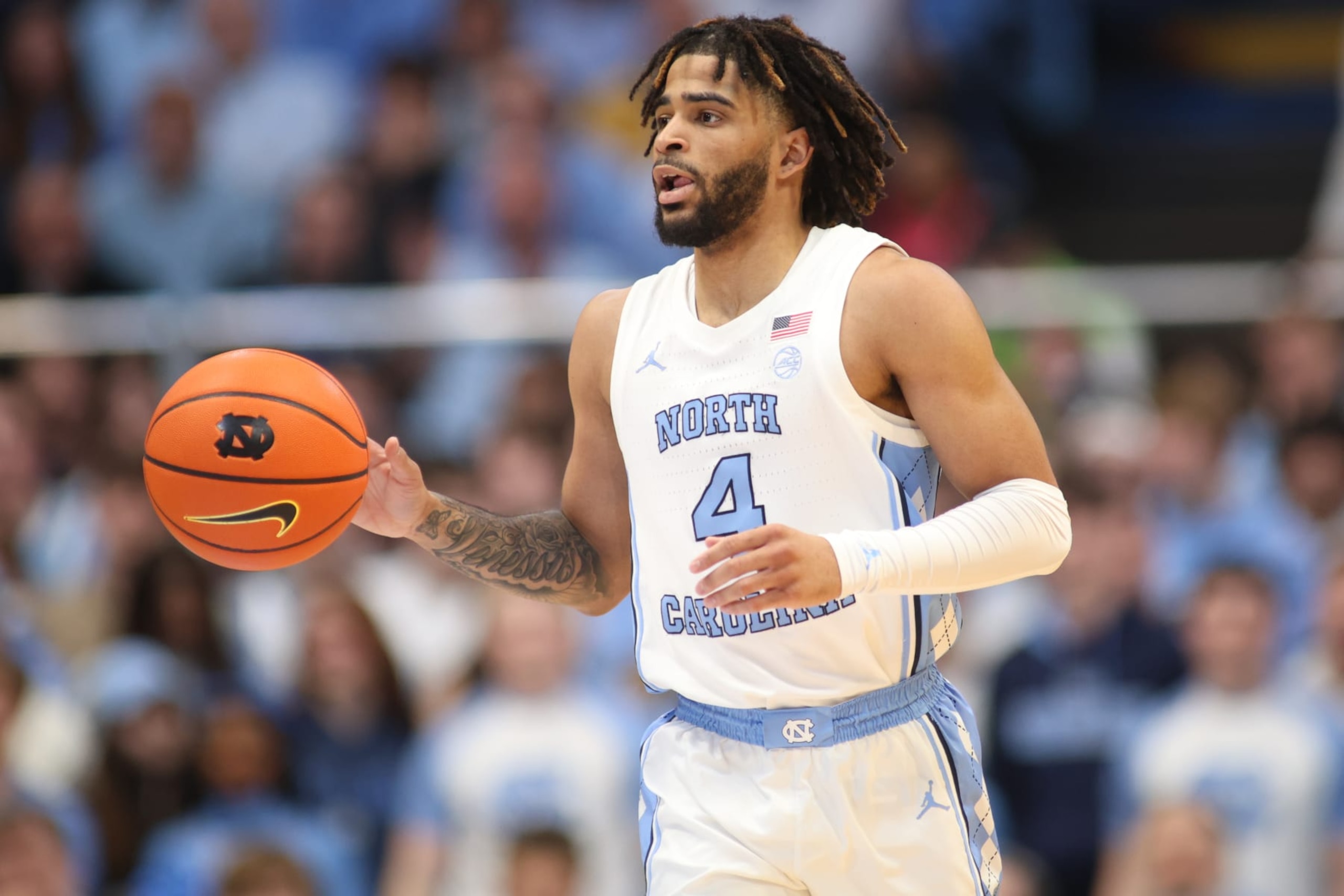 RALEIGH, NC - NOVEMBER 04: North Carolina Tar Heels guard RJ Davis (4) brings the ball up court during the college football game between the North Carolina State Wolfpack and the Miami Hurricanes on November 4, 2023 at Carter-Finley Stadium in Raleigh, NC. (Photo by Nicholas Faulkner/Icon Sportswire via Getty Images)
