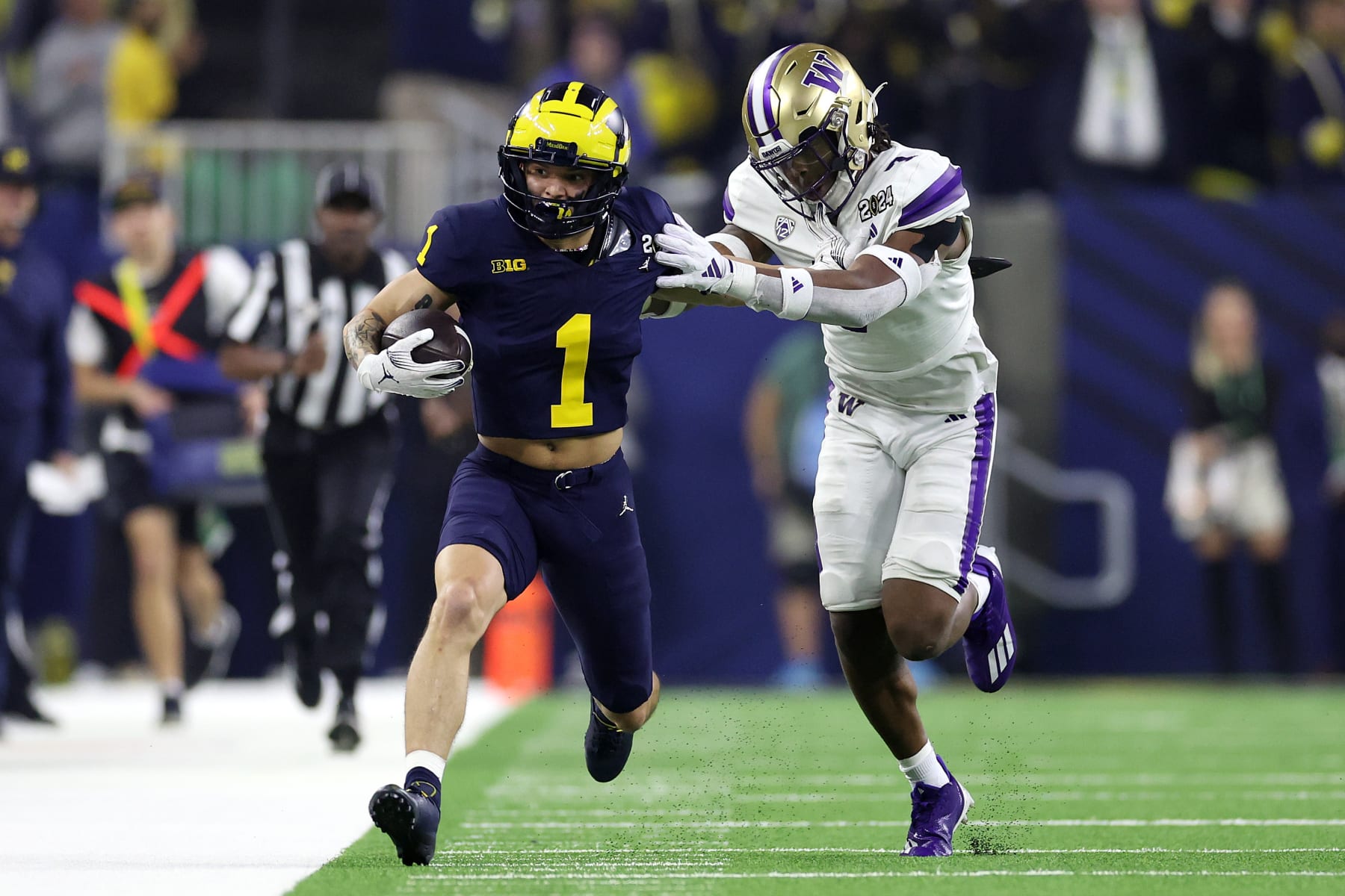 HOUSTON, TEXAS - JANUARY 08: Roman Wilson #1 of the Michigan Wolverines runs with the ball in the first half against the Washington Huskies during the 2024 CFP National Championship game at NRG Stadium on January 08, 2024 in Houston, Texas. (Photo by Maddie Meyer/Getty Images)