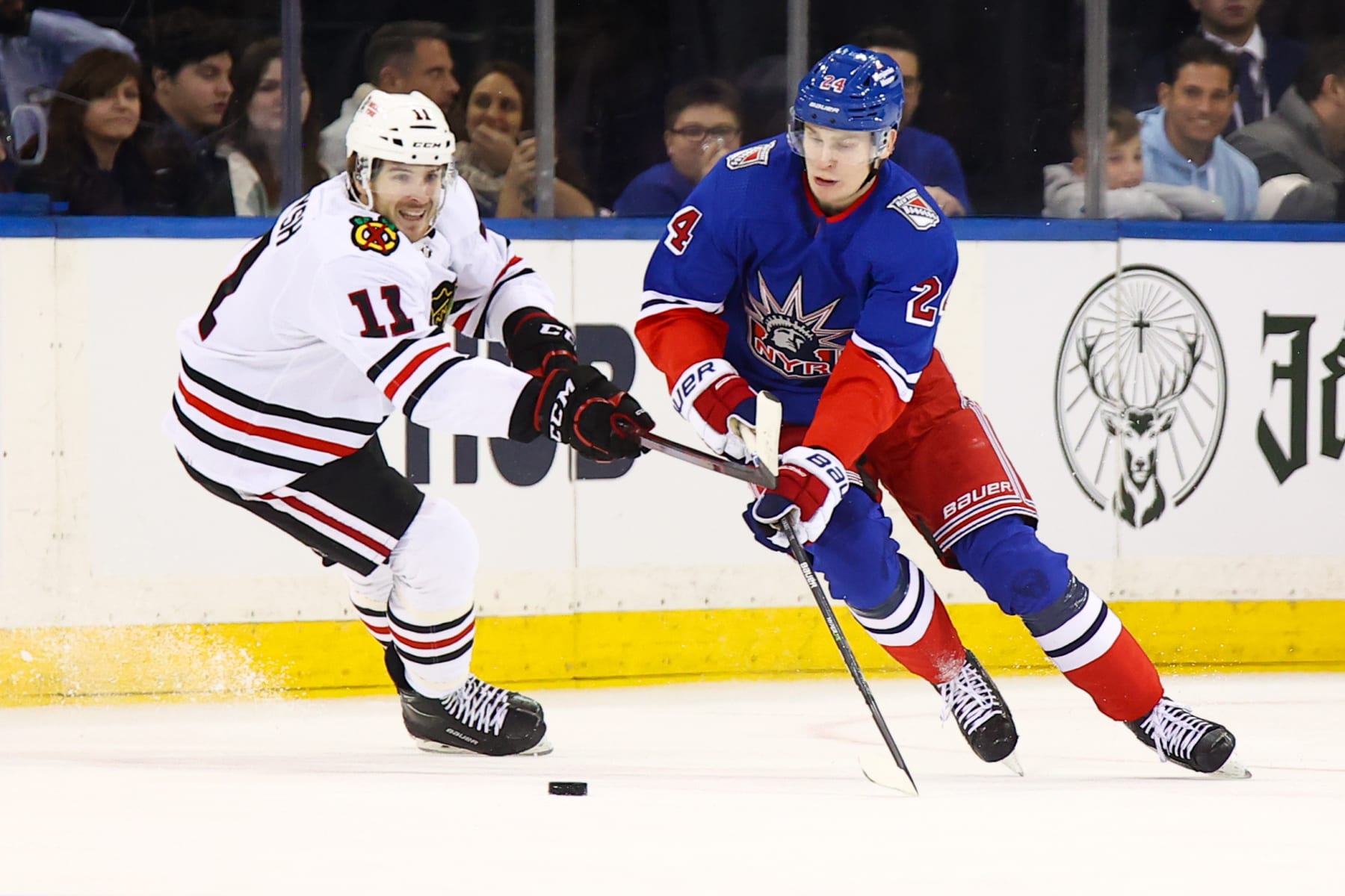 NEW YORK, NY - DECEMBER 03: New York Rangers Right Wing Kaapo Kakko (24) skates against Chicago Blackhawks Right Wing Taylor Raddysh (11) during the National Hockey League game between the Chicago Blackhawks and the New York Rangers on December 3, 2022 at Madison Square Garden in New York, NY. (Photo by Joshua Sarner/Icon Sportswire via Getty Images)