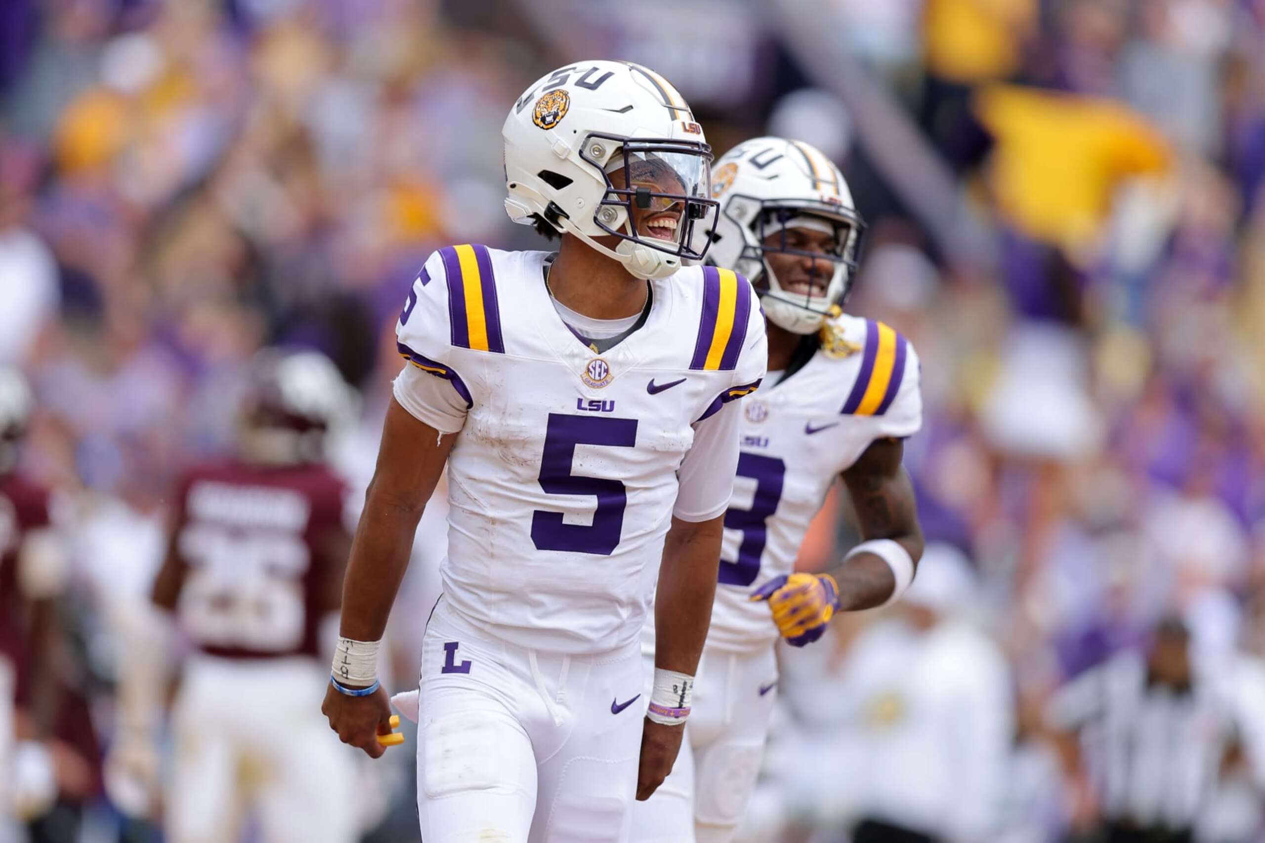 BATON ROUGE, LOUISIANA - NOVEMBER 25: Jayden Daniels #5 of the LSU Tigers celebrates a touchdown during a game against the Texas A&M Aggies at Tiger Stadium on November 25, 2023 in Baton Rouge, Louisiana. (Photo by Jonathan Bachman/Getty Images)