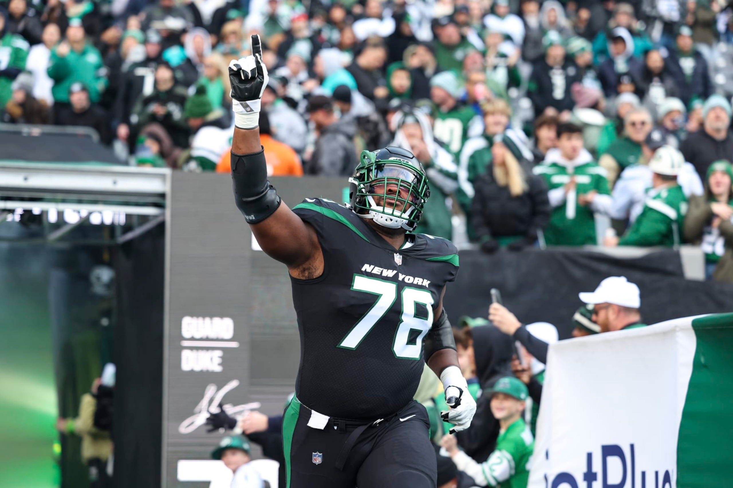 EAST RUTHERFORD, NJ - NOVEMBER 24: Laken Tomlinson #78 of the New York Jets runs out of the tunnel prior to an NFL football game against the Miami Dolphins at MetLife Stadium on November 24, 2023 in East Rutherford, New Jersey. (Photo by Perry Knotts/Getty Images)