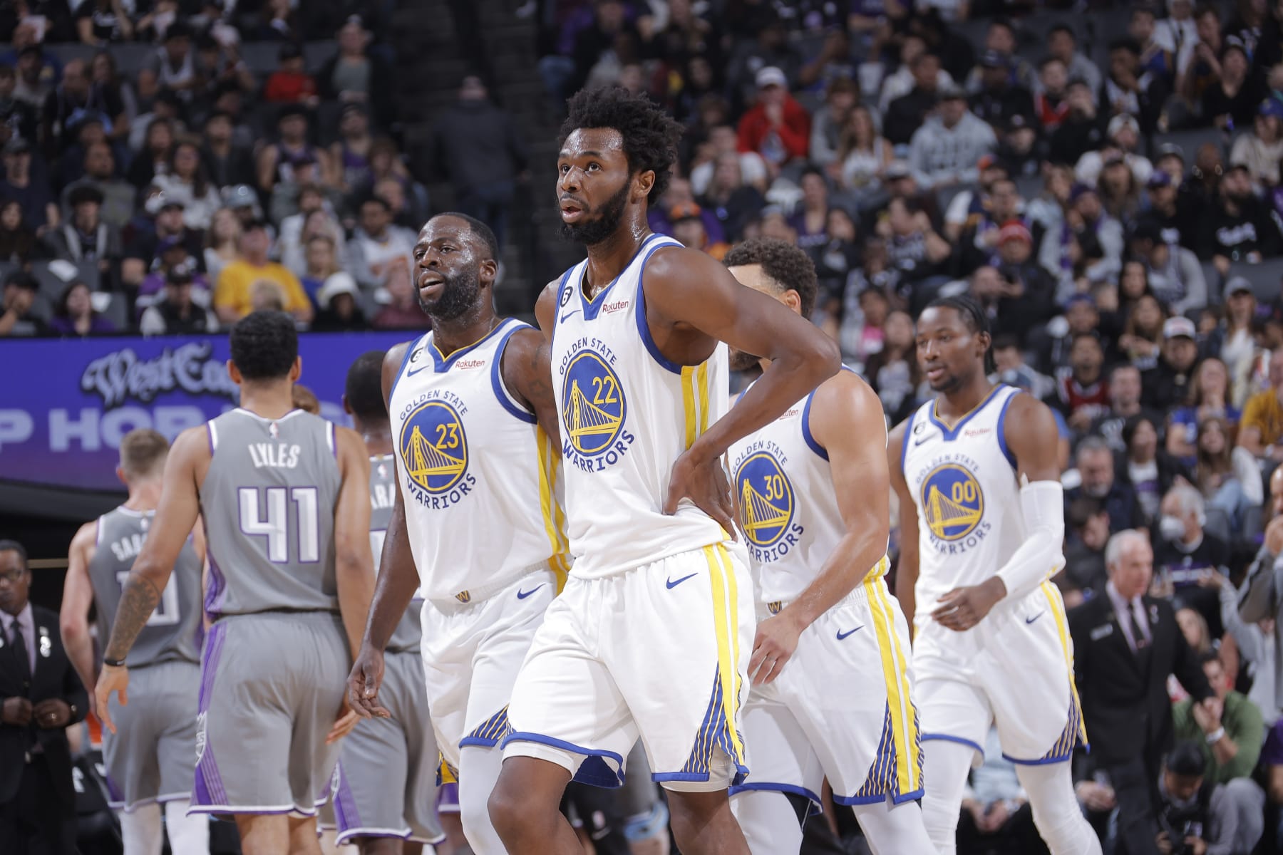 SACRAMENTO, CA - NOVEMBER 13: Draymond Green #23 and Andrew Wiggins #22 of the Golden State Warriors look on during the game against the Sacramento Kings on November 13, 2022 at Golden 1 Center in Sacramento, California. NOTE TO USER: User expressly acknowledges and agrees that, by downloading and or using this photograph, User is consenting to the terms and conditions of the Getty Images Agreement. Mandatory Copyright Notice: Copyright 2022 NBAE (Photo by Rocky Widner/NBAE via Getty Images)