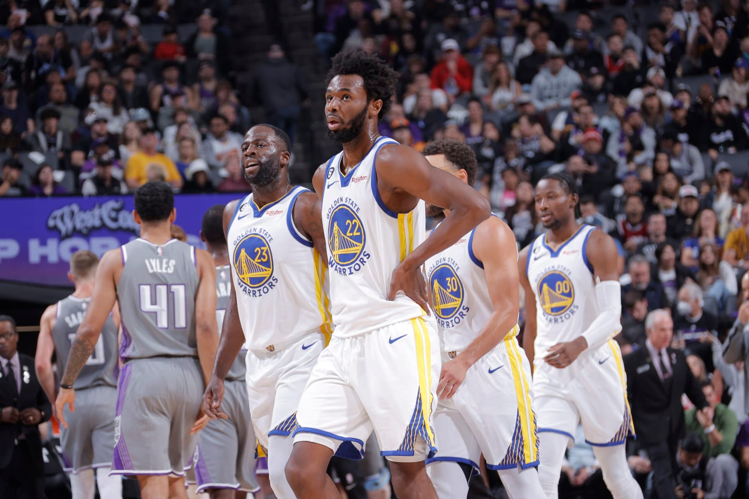 SACRAMENTO, CA - NOVEMBER 13: Draymond Green #23 and Andrew Wiggins #22 of the Golden State Warriors look on during the game against the Sacramento Kings on November 13, 2022 at Golden 1 Center in Sacramento, California. NOTE TO USER: User expressly acknowledges and agrees that, by downloading and or using this photograph, User is consenting to the terms and conditions of the Getty Images Agreement. Mandatory Copyright Notice: Copyright 2022 NBAE (Photo by Rocky Widner/NBAE via Getty Images)