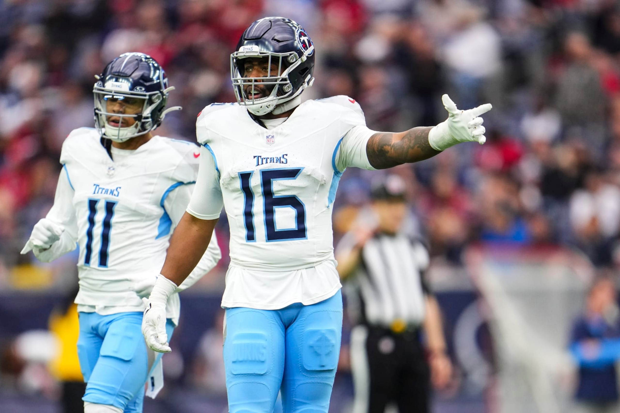 HOUSTON, TX - DECEMBER 31: Treylon Burks #16 of the Tennessee Titans looks on from the field an NFL football game against the Houston Texans at NRG Stadium on December 31, 2023 in Houston, Texas. (Photo by Cooper Neill/Getty Images)