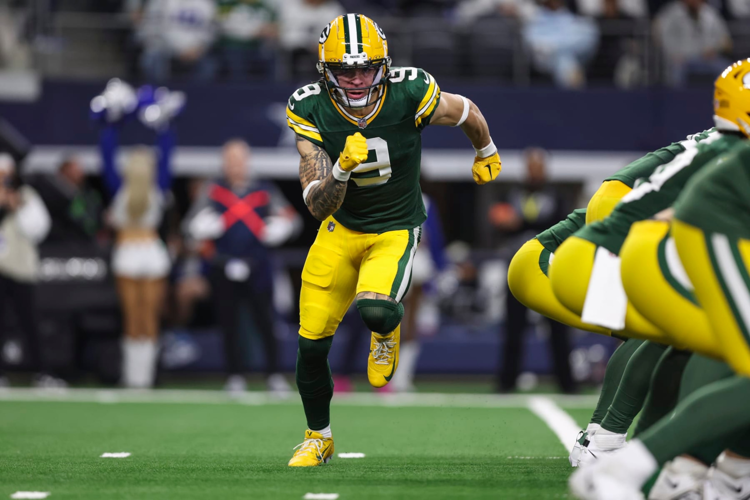 ARLINGTON, TX - JANUARY 14: Christian Watson #9 of the Green Bay Packers is set in motion during an NFL wild-card playoff football game against the Dallas Cowboys at AT&T Stadium on January 14, 2024 in Arlington, Texas. (Photo by Perry Knotts/Getty Images)