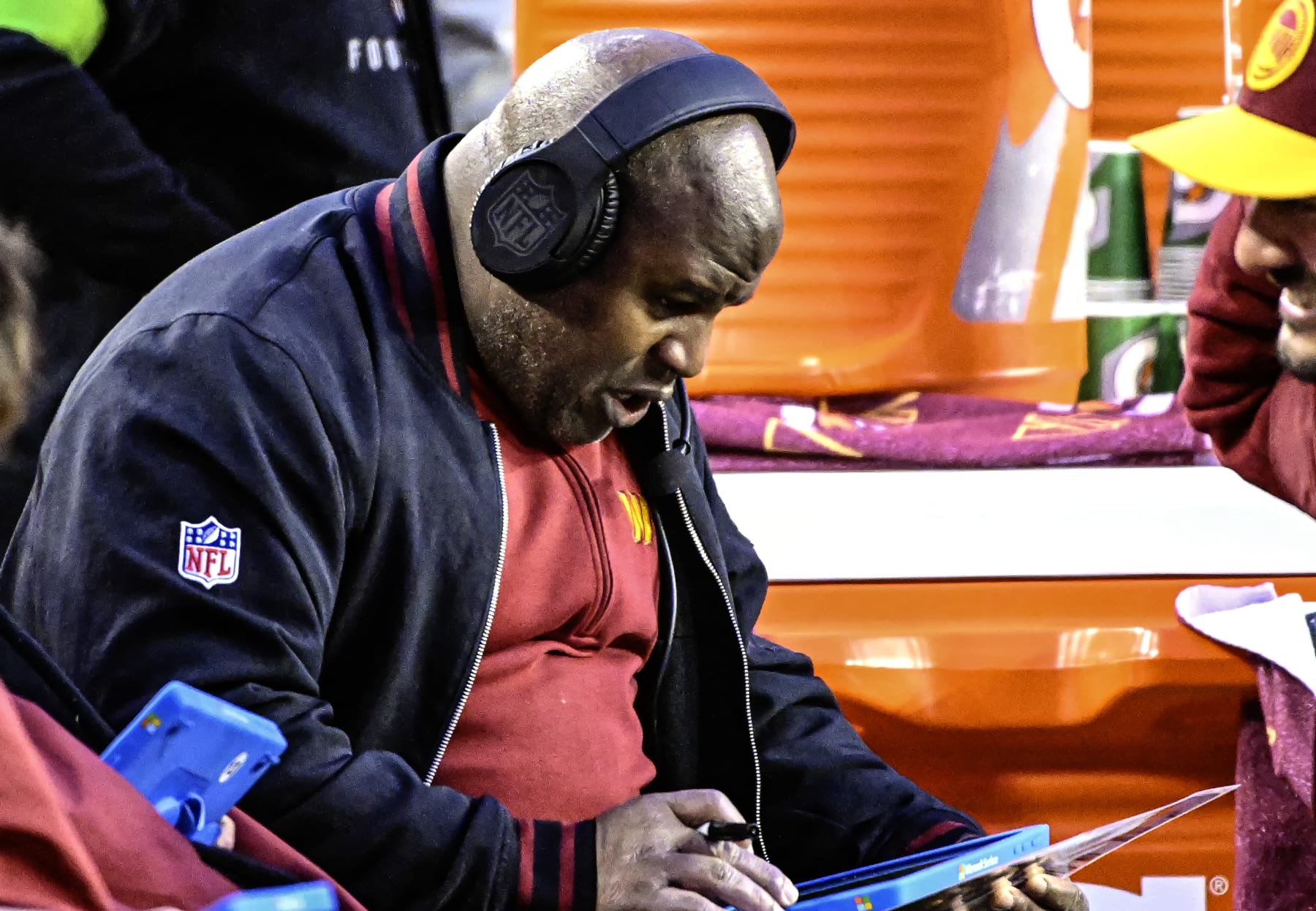 LANDOVER, MD - JANUARY 07: Washington Commanders offensive coordinator, Eric Bieniemy, reviews a play during the NFL game between the Dallas Cowboys and the Washington Commanders on January 7, 2024 at Fed Ex Field in Landover, MD. (Photo by Mark Goldman/Icon Sportswire via Getty Images)