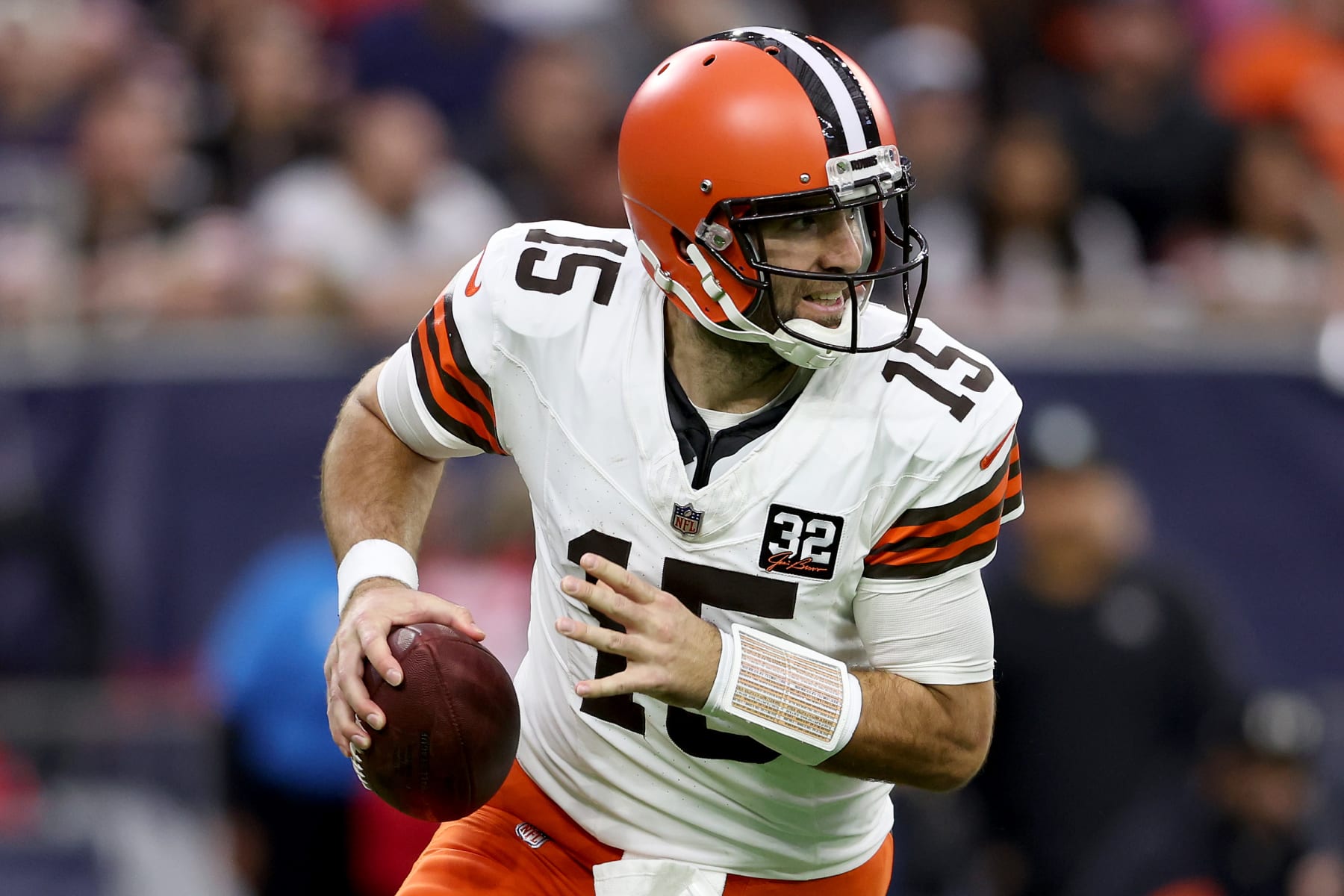 HOUSTON, TEXAS - JANUARY 13: Joe Flacco #15 of the Cleveland Browns scrambles against the Houston Texans in the AFC Wild Card Playoffs at NRG Stadium on January 13, 2024 in Houston, Texas. (Photo by Tim Warner/Getty Images)