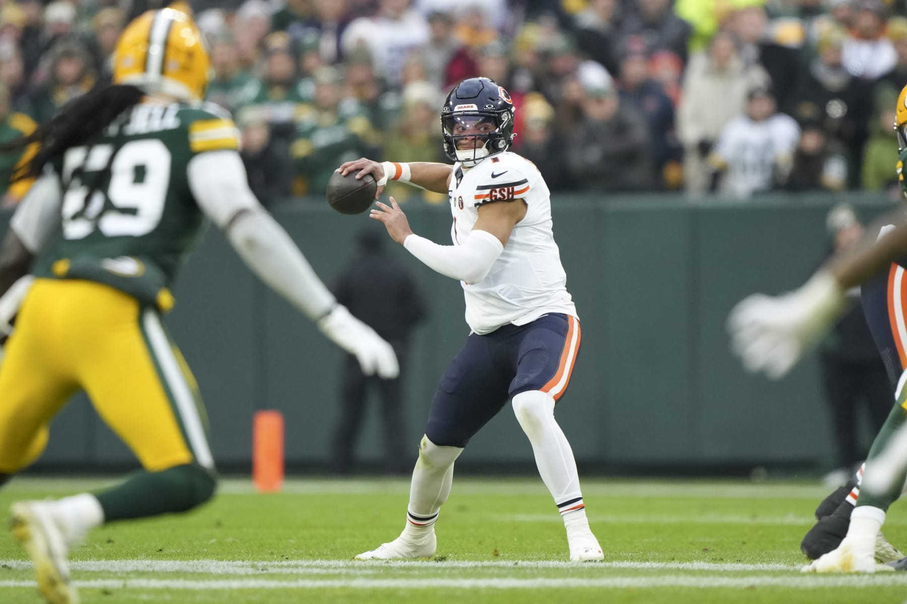 GREEN BAY, WI - JANUARY 7: Quarterback Justin Fields #1 of the Chicago Bears sets to throw during the first half of an NFL football game against the Green Bay Packers at Lambeau Field on January 7, 2024 in Green Bay, Wisconsin. The Packers beat the Bears 17-9. (Photo by Todd Rosenberg/Getty Images)