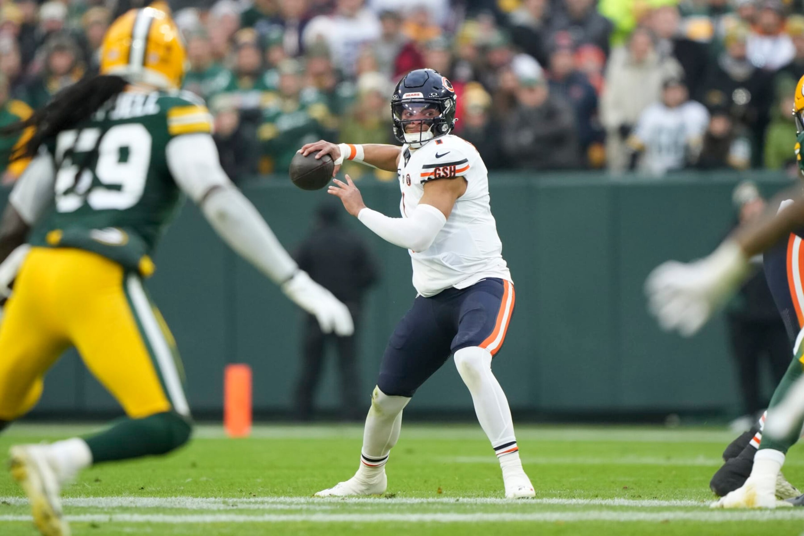 GREEN BAY, WI - JANUARY 7: Quarterback Justin Fields #1 of the Chicago Bears sets to throw during the first half of an NFL football game against the Green Bay Packers at Lambeau Field on January 7, 2024 in Green Bay, Wisconsin. The Packers beat the Bears 17-9. (Photo by Todd Rosenberg/Getty Images)