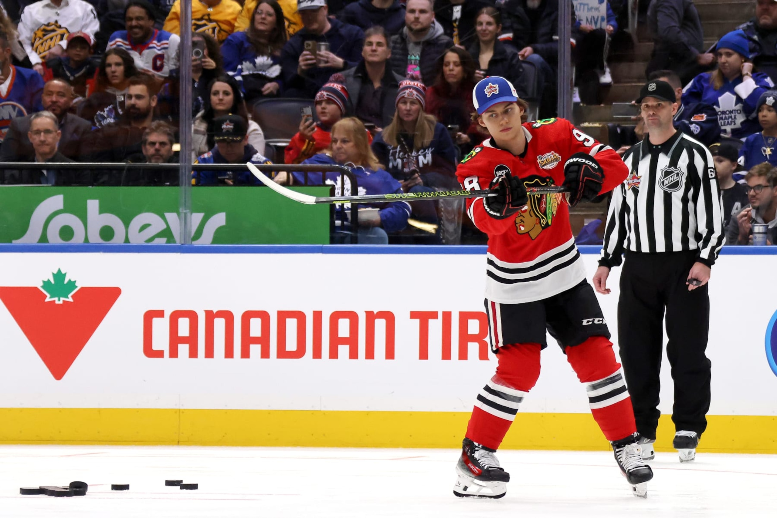 TORONTO, ONTARIO - FEBRUARY 02: Connor Bedard #98 of the Chicago Blackhawks feeds passes in the Tim Hortons NHL One Timers during 2024 NHL All-Star Skills Competition at Scotiabank Arena on February 02, 2024 in Toronto, Ontario. (Photo by Bruce Bennett/Getty Images)