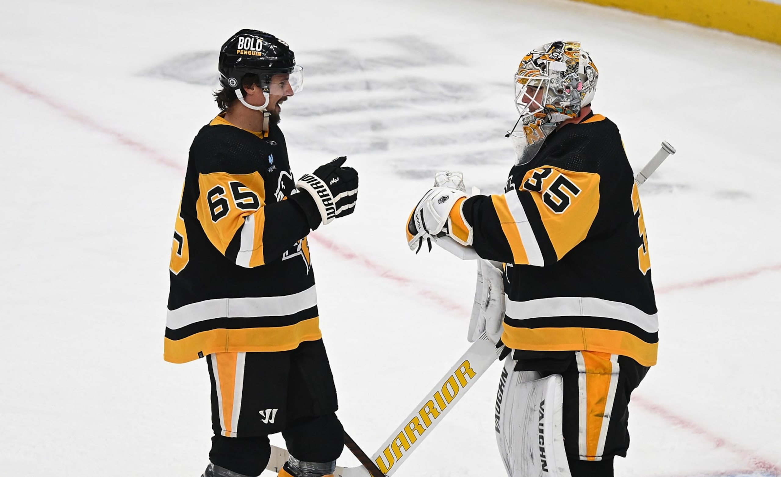 PITTSBURGH, PENNSYLVANIA - FEBRUARY 6: Tristan Jarry #35 of the Pittsburgh Penguins celebrates with Erik Karlsson #65 after posting a shutout in a 3-0 win over the Winnipeg Jets at PPG PAINTS Arena on February 6, 2024 in Pittsburgh, Pennsylvania. (Photo by Justin Berl/Getty Images)