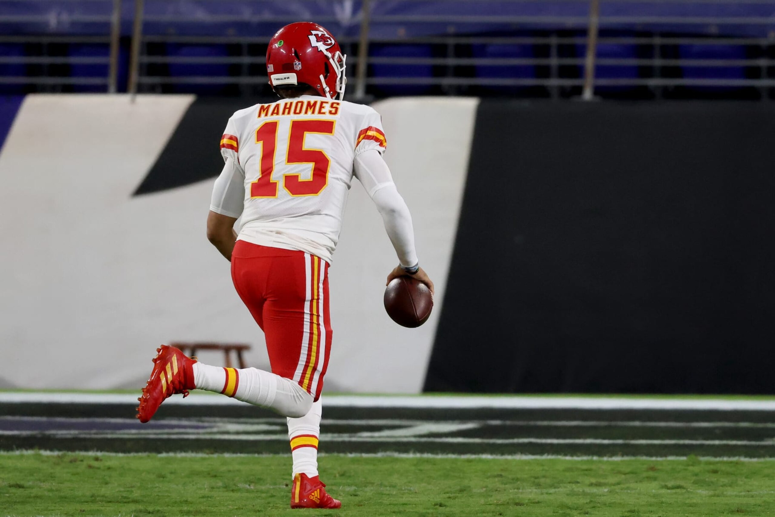 BALTIMORE, MARYLAND - SEPTEMBER 28: Quarterback Patrick Mahomes #15 of the Kansas City Chiefs rushes for a touchdown against the Baltimore Ravens in the first half  at M&T Bank Stadium on September 28, 2020 in Baltimore, Maryland. (Photo by Rob Carr/Getty Images)